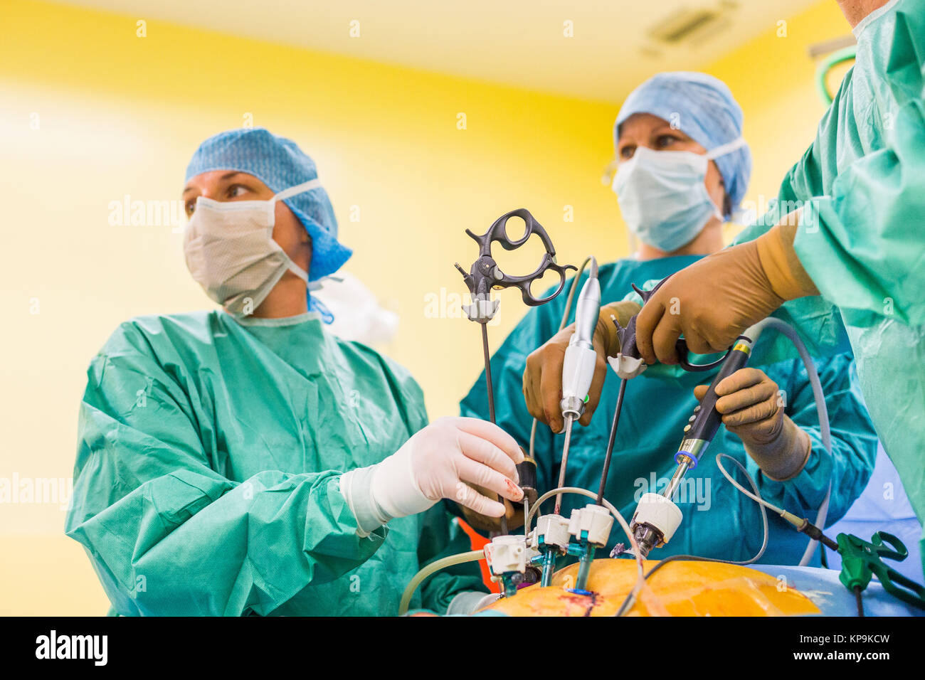Surgical team performing prostatectomy (prostate ablation) under coeliosurgery, Angouleme hospital, France. Stock Photo