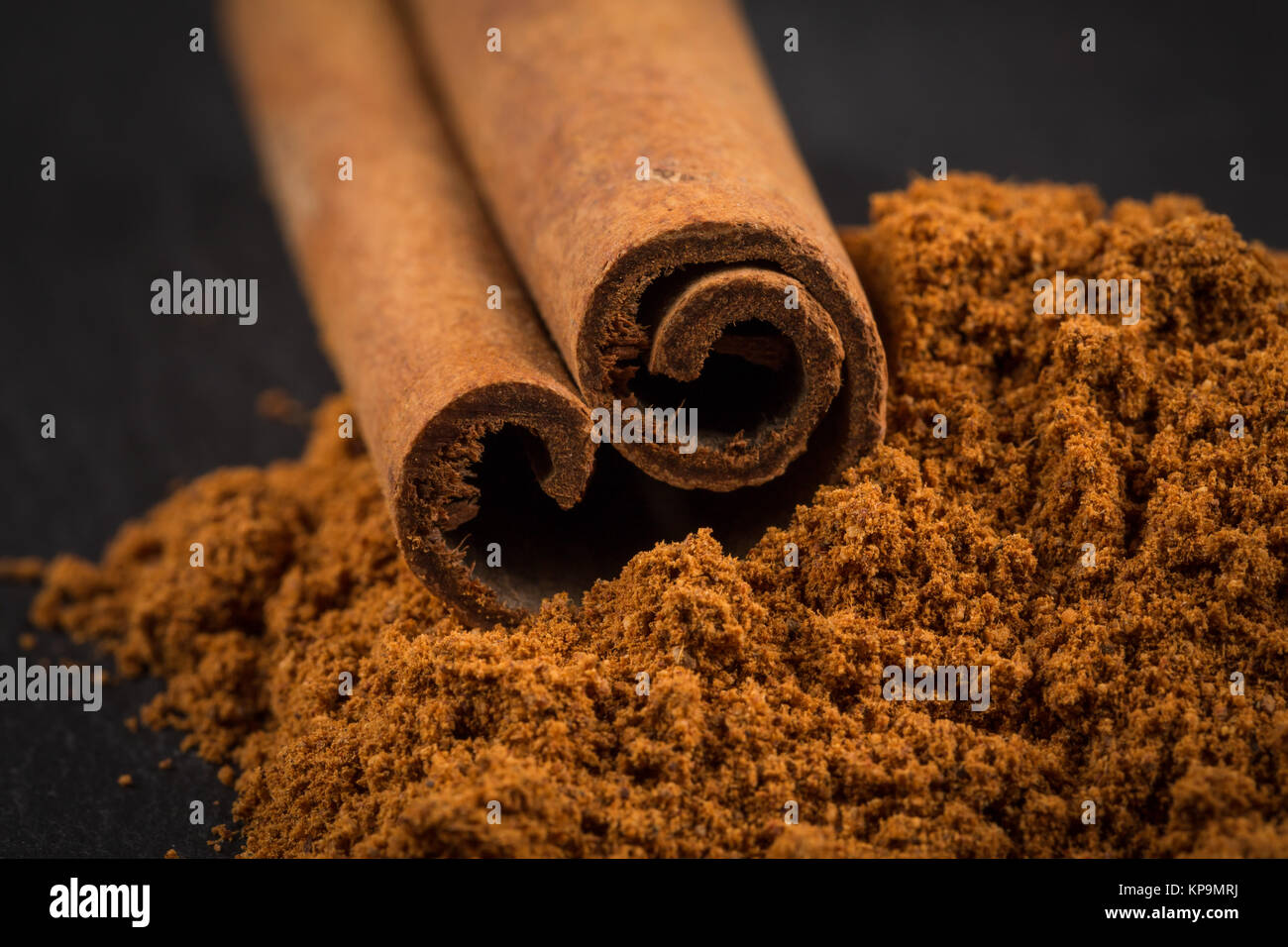 Cinnamon sticks with powder Stock Photo Alamy