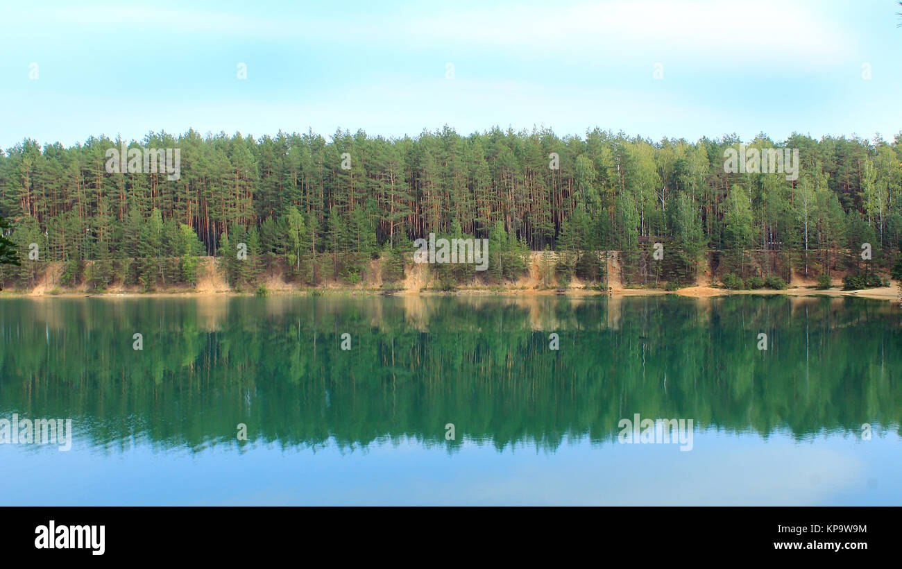 beautiful lake with azure water in the forest Stock Photo - Alamy
