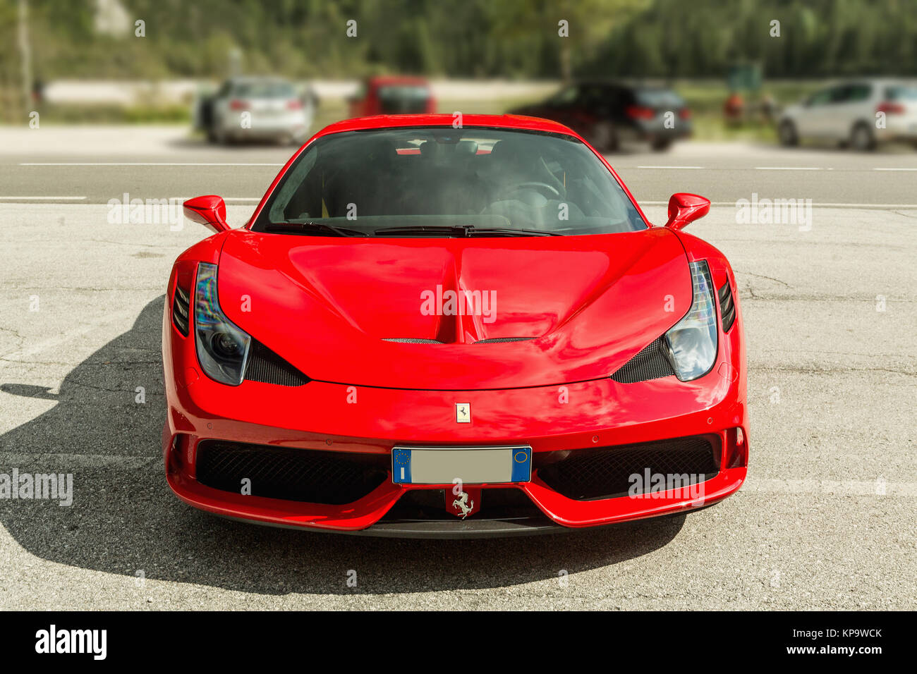 DOLOMITI, Lago di Landro, ITALY - SEPTEMBER 10, 2016: Red Ferrari 488 GTB parking on Lago di Landro. The 488GTB is a heavily re-engineered replacement Stock Photo