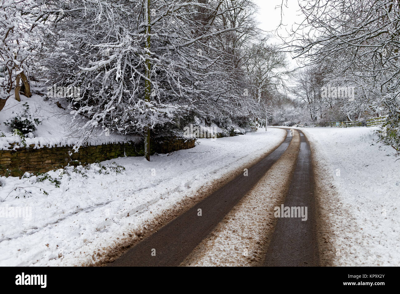 Snow covered road through a small village Stock Photo - Alamy