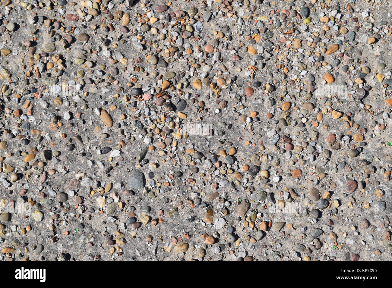 Pellet in old asphalt Stock Photo - Alamy