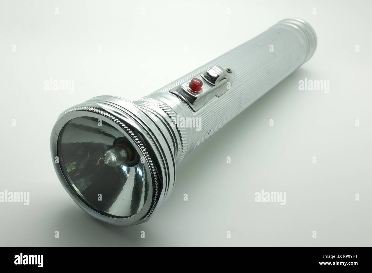 Old metal flashlight, silver torch Stock Photo