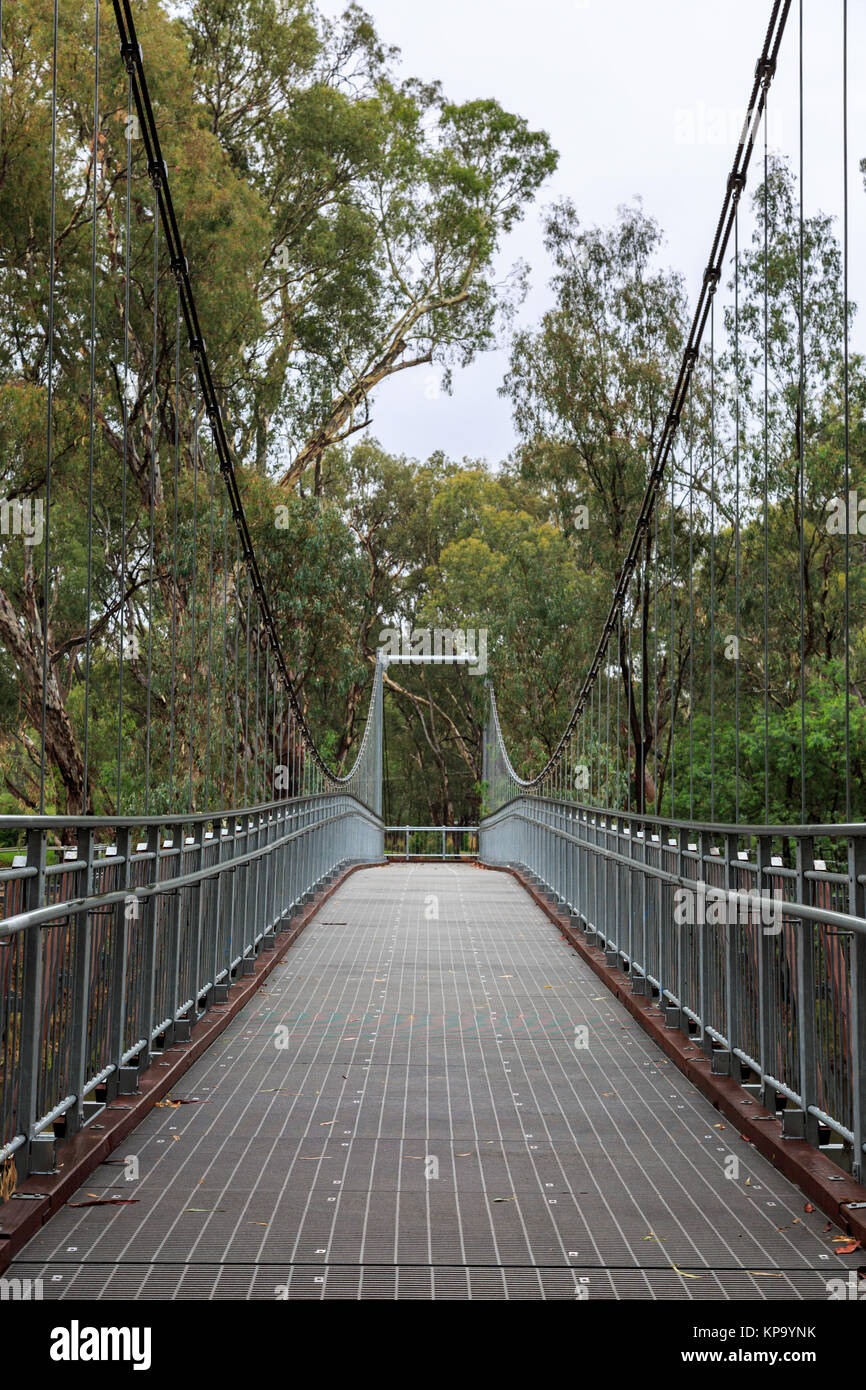 Steel Suspension footbridge over river Stock Photo Alamy
