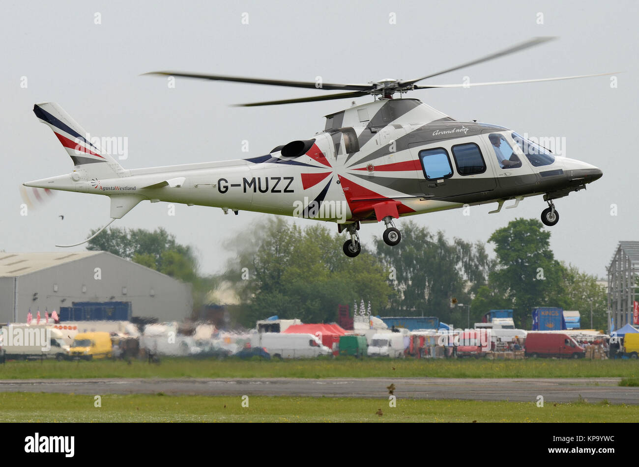Agusta Westland A109 AW109 Grand New helicopter G-MUZZ owned by Hagondale Ltd operated by Saxonair Charter Ltd lifting off at North Weald Airfield Stock Photo