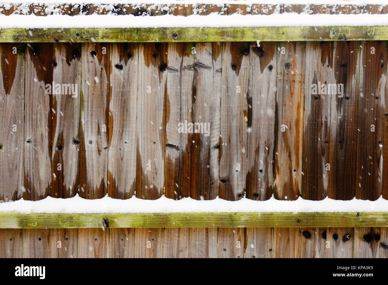 Part of a wooden garden fence with fresh snow Stock Photo - Alamy
