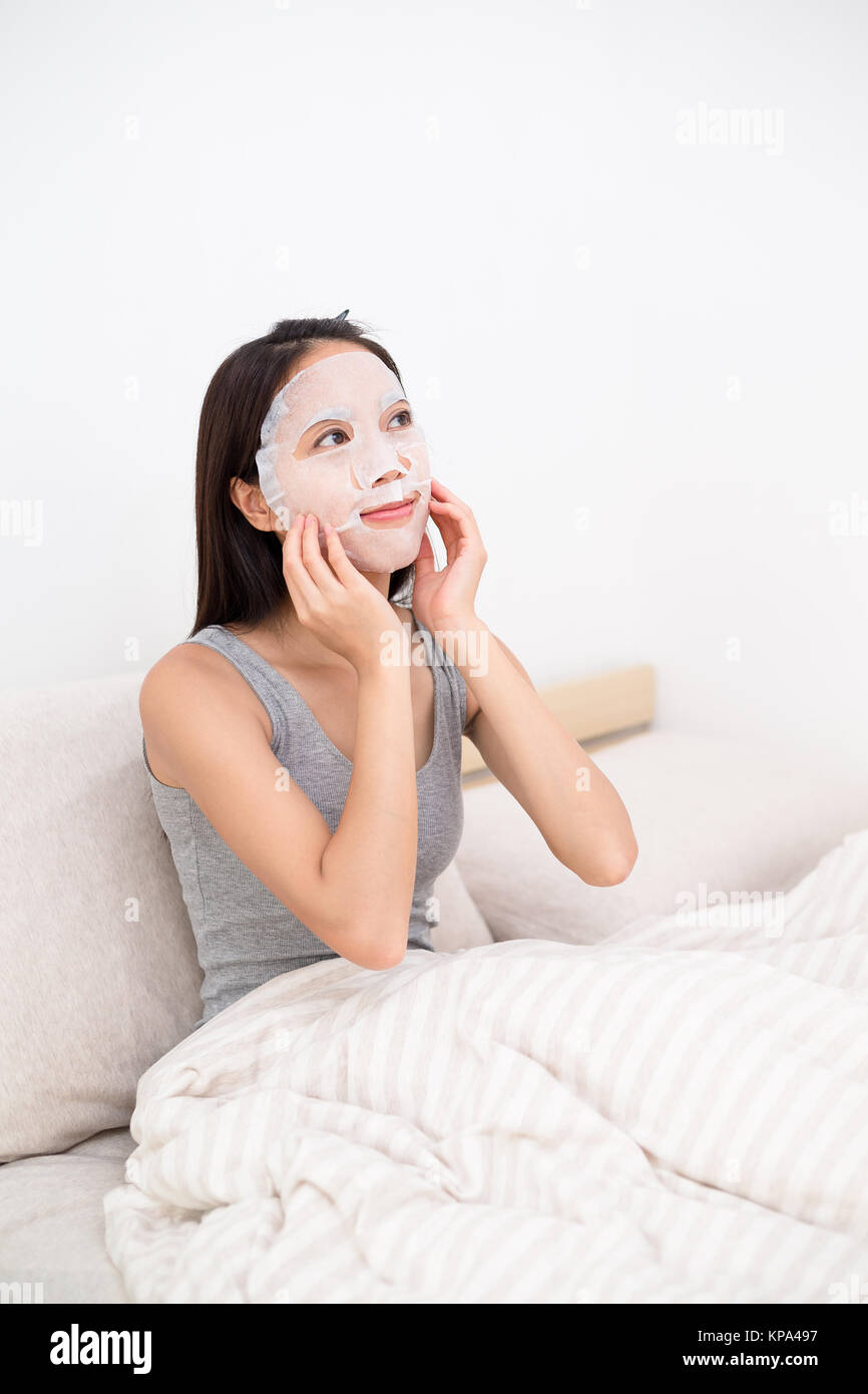 Woman using the paper mask Stock Photo - Alamy