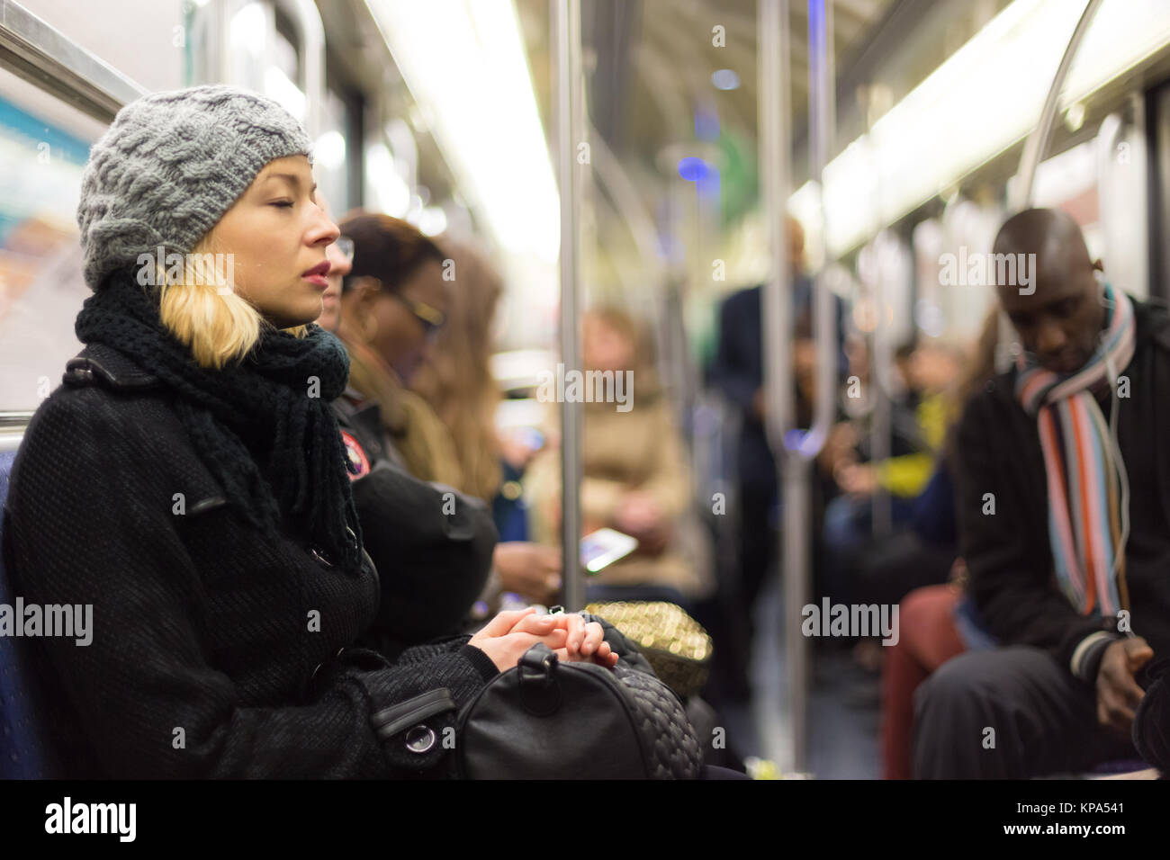 Tired woman on the subway train hi-res stock photography and images - Alamy