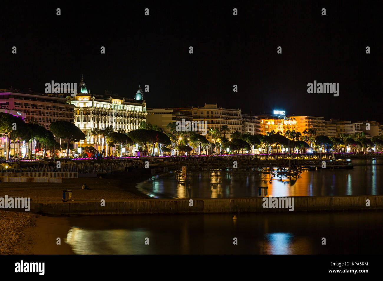 CANNES, FRANCE - September 8 2015, Night view. Image shows the cosmopolitan city of Cannes in the French Riviera, in the background illuminated city Stock Photo