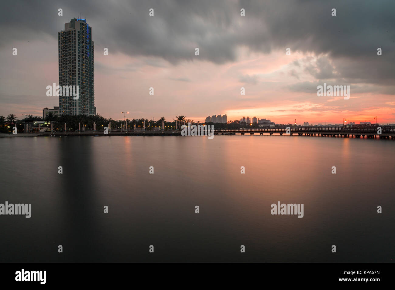 Colorful sunset over the beach Ancol Jakarta. Stock Photo