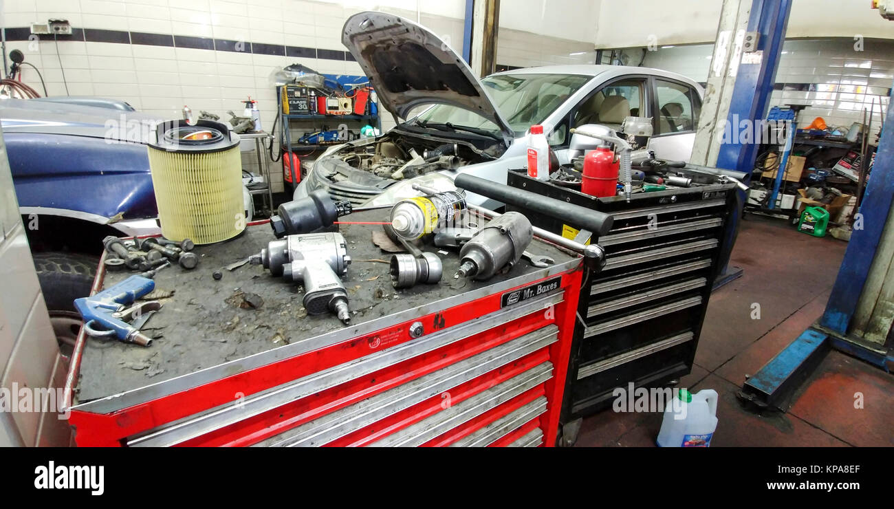 Car being serviced in a garage Stock Photo Alamy