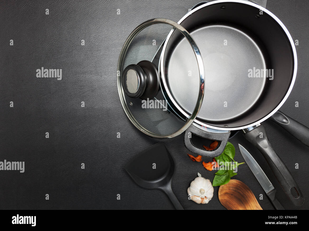 Top view frying pan and pot on black table Stock Photo Alamy