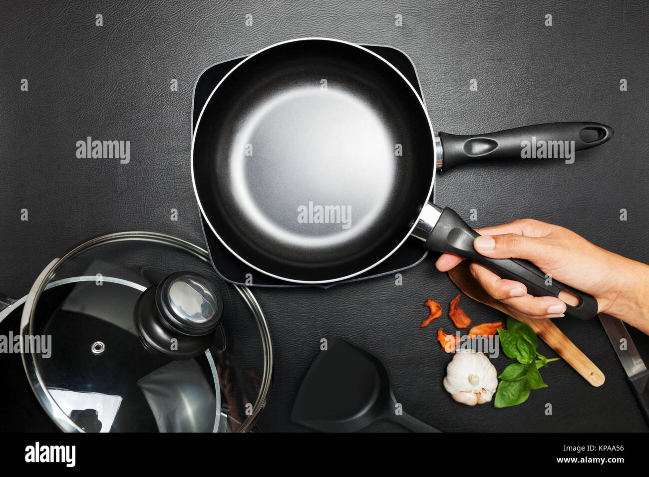 Top view frying pan and pot on black table Stock Photo Alamy