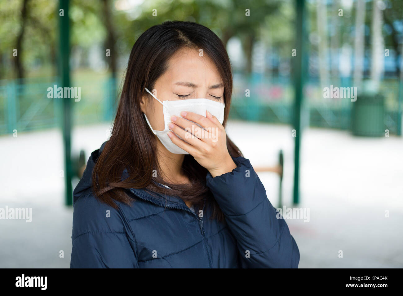 Woman wearing protective face mask Stock Photo - Alamy