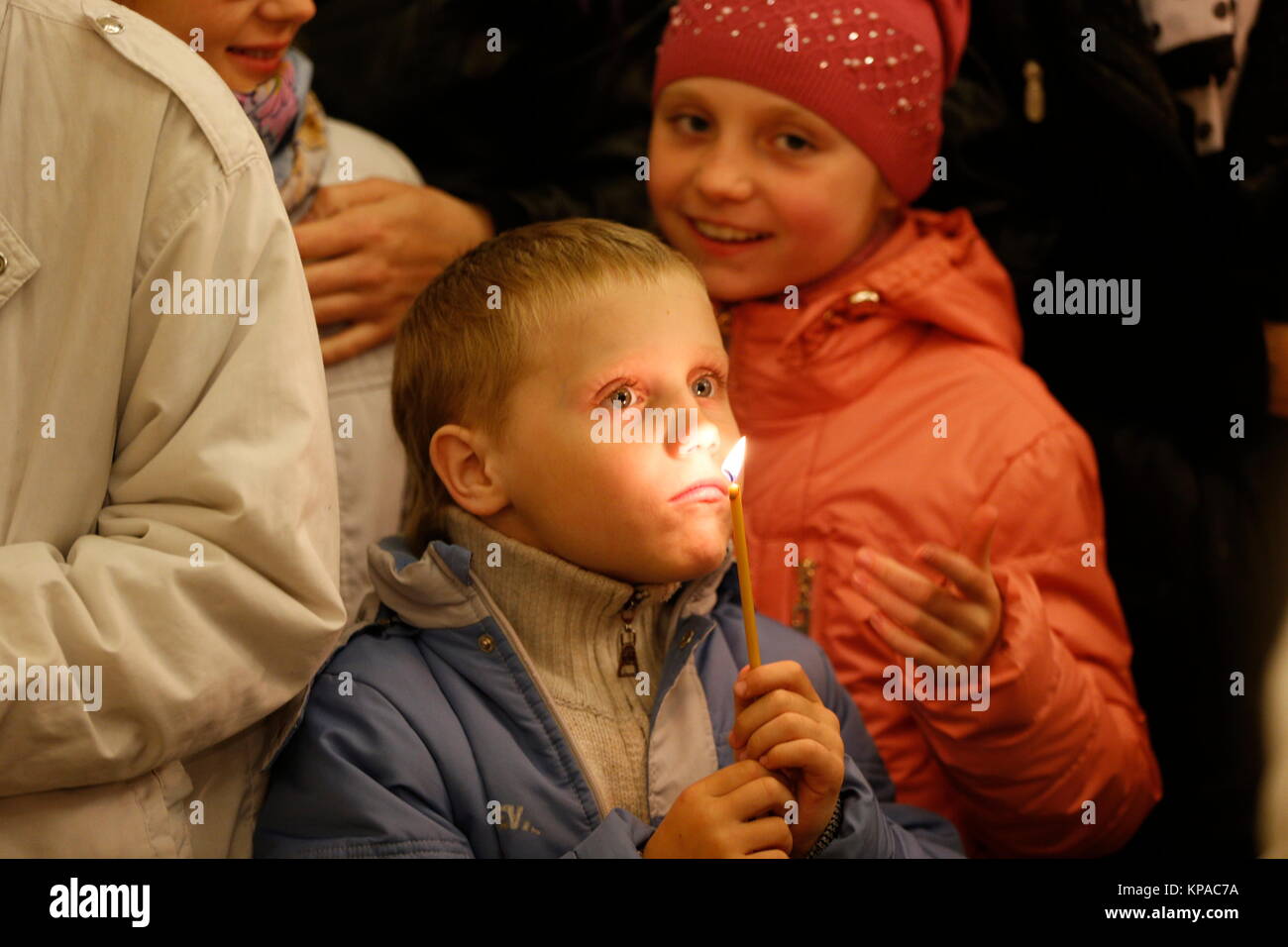 Belarus, Gomel city, celebrating the church holiday of Easter in St. Nicholas Monastery 01.05. 2016 year. Unknown boy holds a candle.boy in church Stock Photo