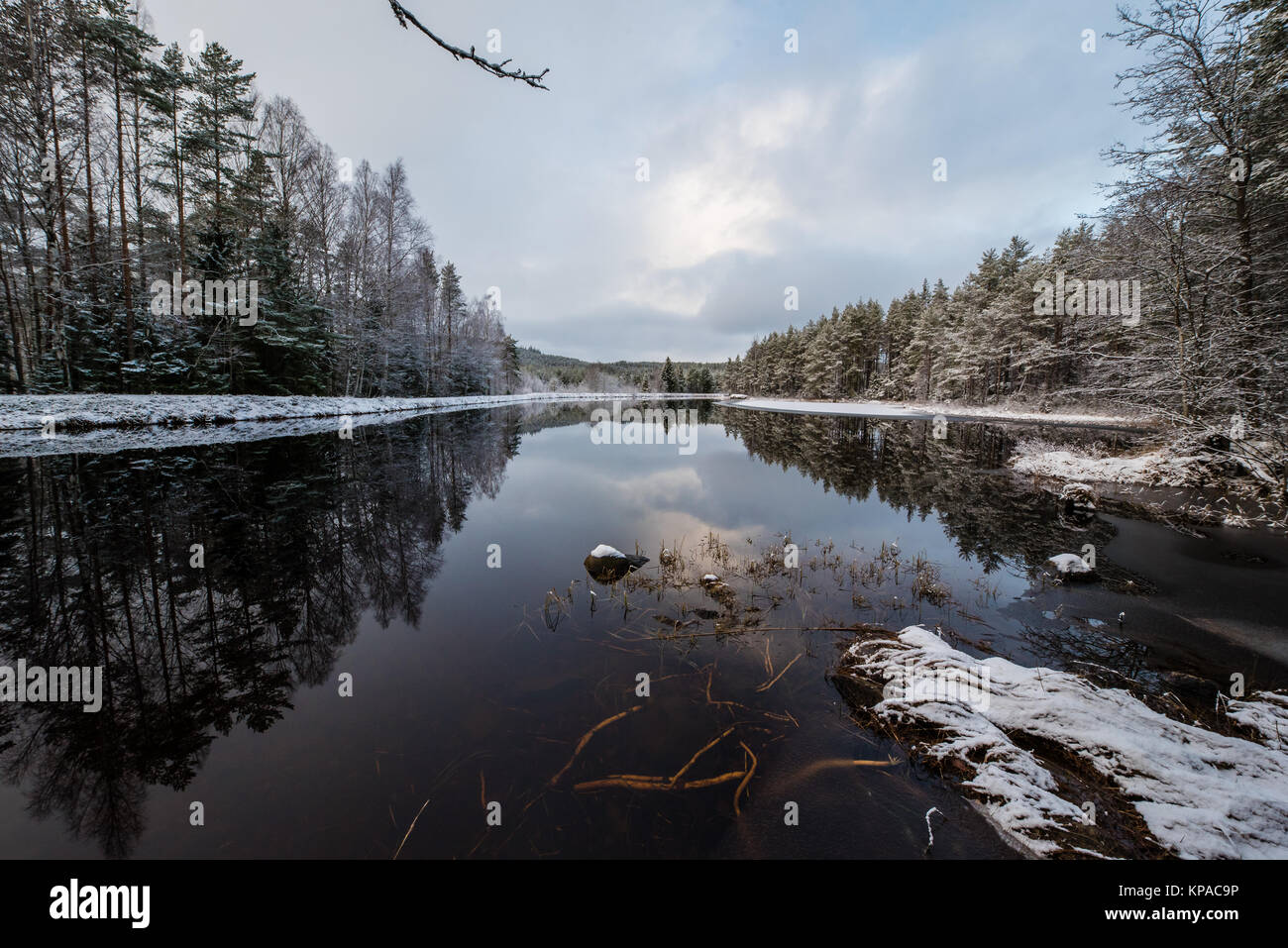 A snowy landscape overlooking water and ice Stock Photo - Alamy