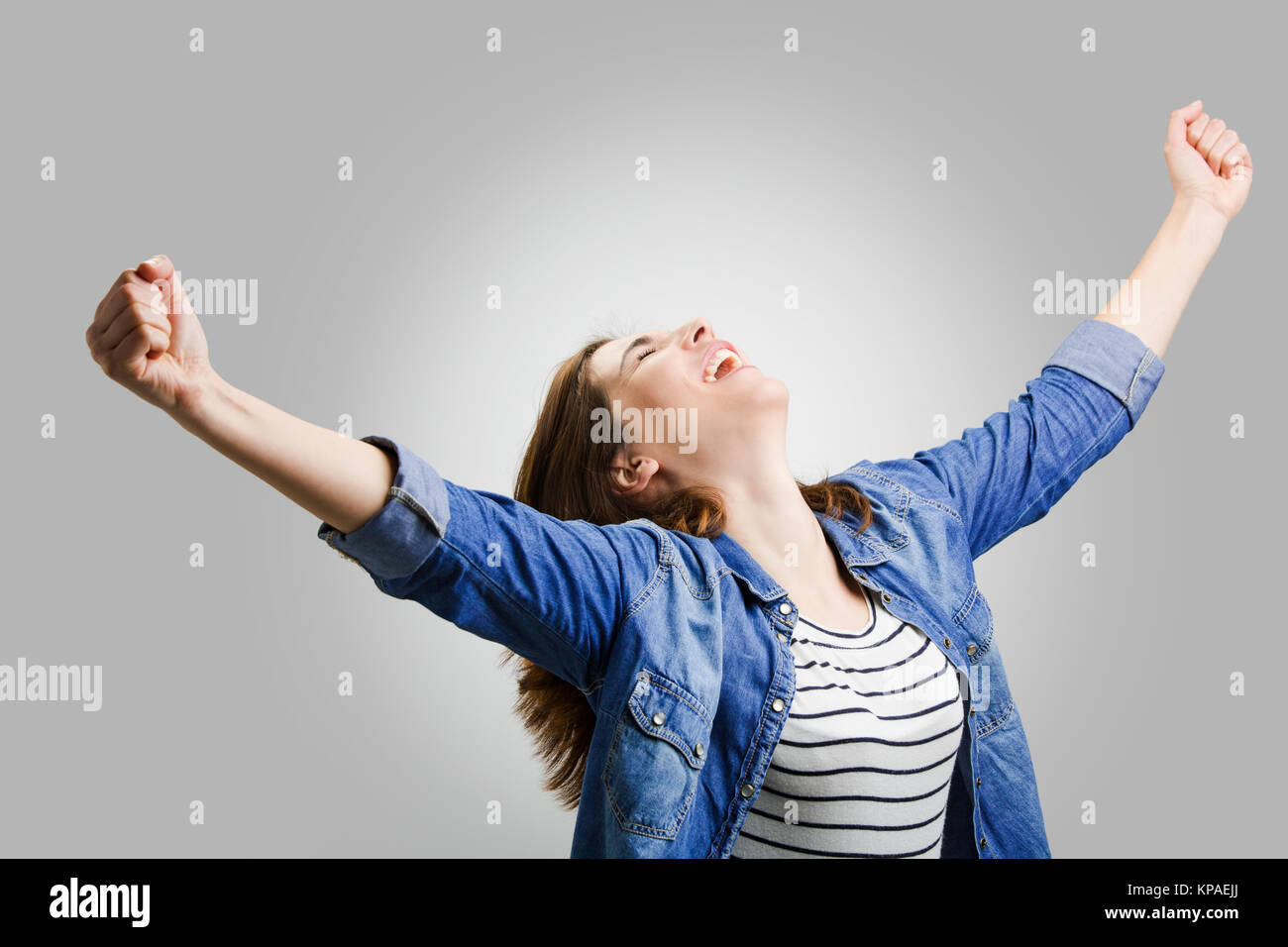 Joyful young woman celebrates win hi-res stock photography and images ...