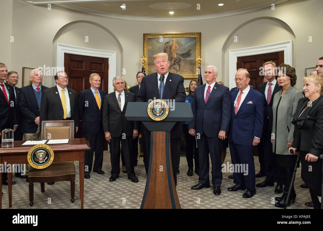 United States President Donald J. Trump speaks before signing the Presidential Space Directive - 1, directing NASA to return to the moon, alongside US Vice President Mike Pence, members of the Senate, Congress, NASA, and commercial space companies in the Roosevelt Room of the White House in Washington, Monday, December 11, 2017. Mandatory Credit: Aubrey Gemignani / NASA via CNP       - NO WIRE SERVICE - Photo: Aubrey Gemignani/Consolidated/dpa Stock Photo