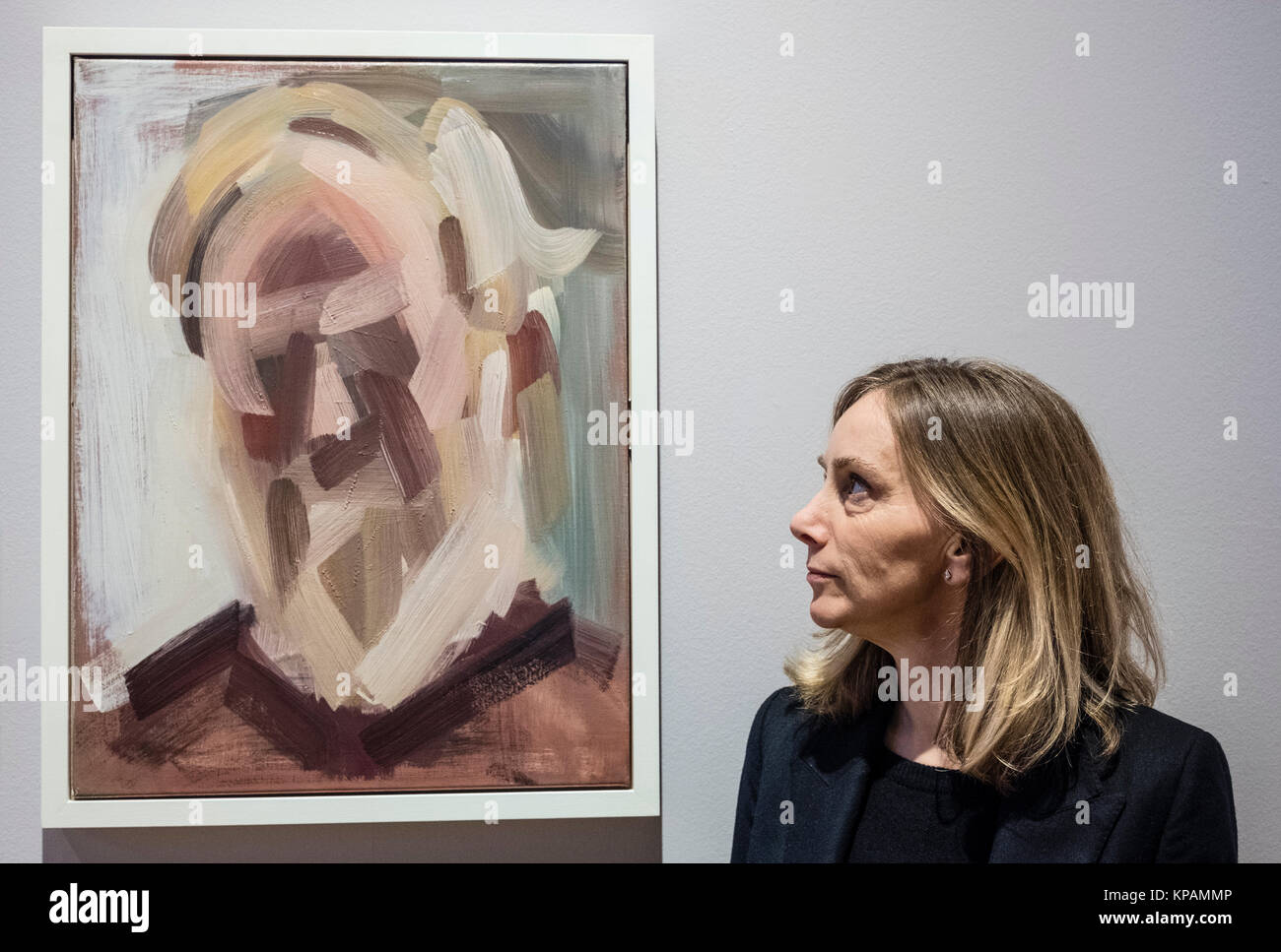Edinburgh, Scotland, United Kingdom. 14 December, 2017.   Lucy Stopford and her painting Portrait of Dr Tim Moreton at The BP Portrait Award 2017  which opens at the Scottish National Portrait Gallery on 16 December 2017. Credit: Iain Masterton/Alamy Live News Stock Photo