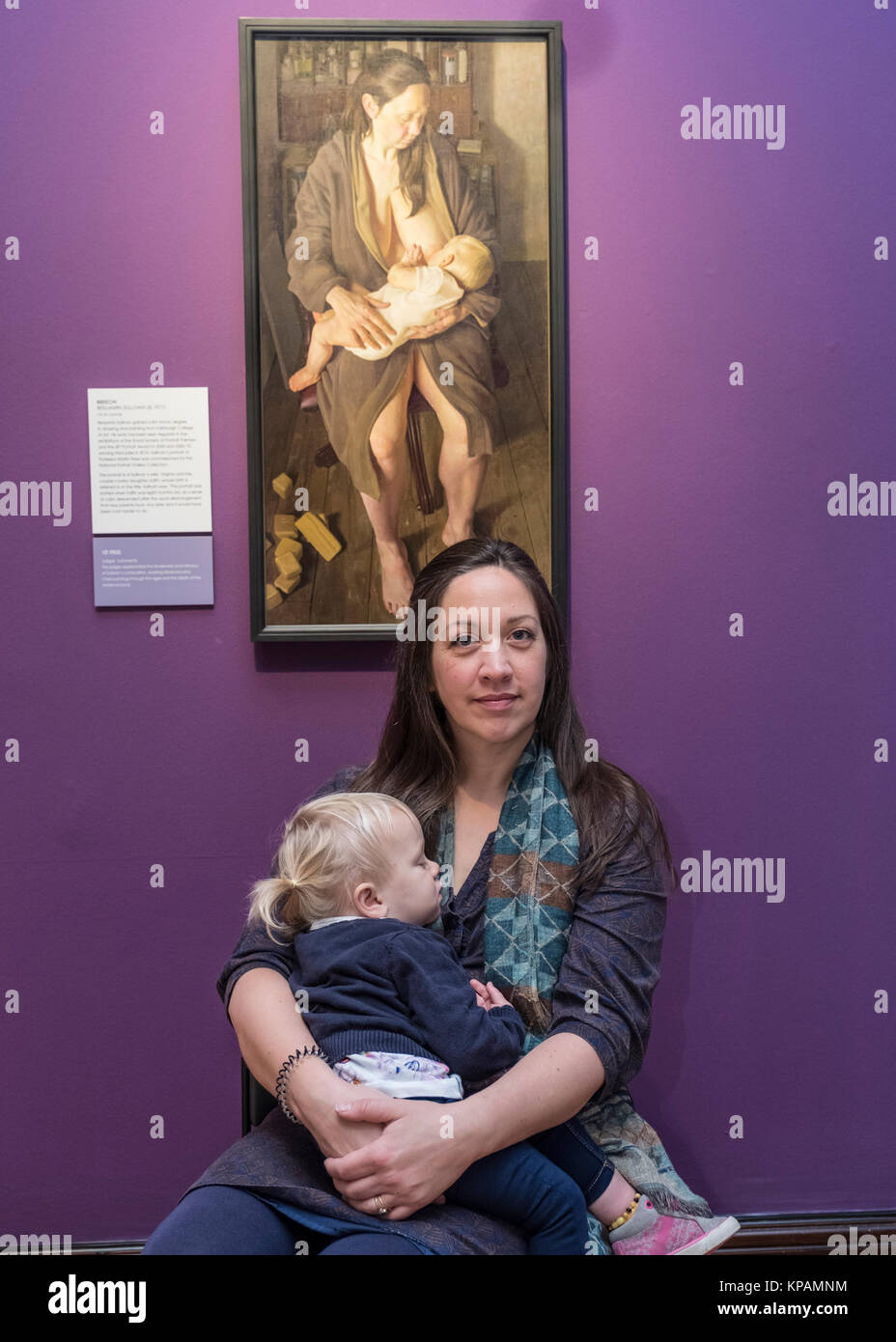 Edinburgh, Scotland, United Kingdom. 14 December, 2017.   Winning painting of BP Portrait Award 2017, Breech! With the subject of the painting, artist's wife Virginia and her baby at the opening of the exhibition. The BP Portrait Award 2017 opens at the Scottish National Portrait Gallery on 16 December 2017. Credit: Iain Masterton/Alamy Live News Stock Photo