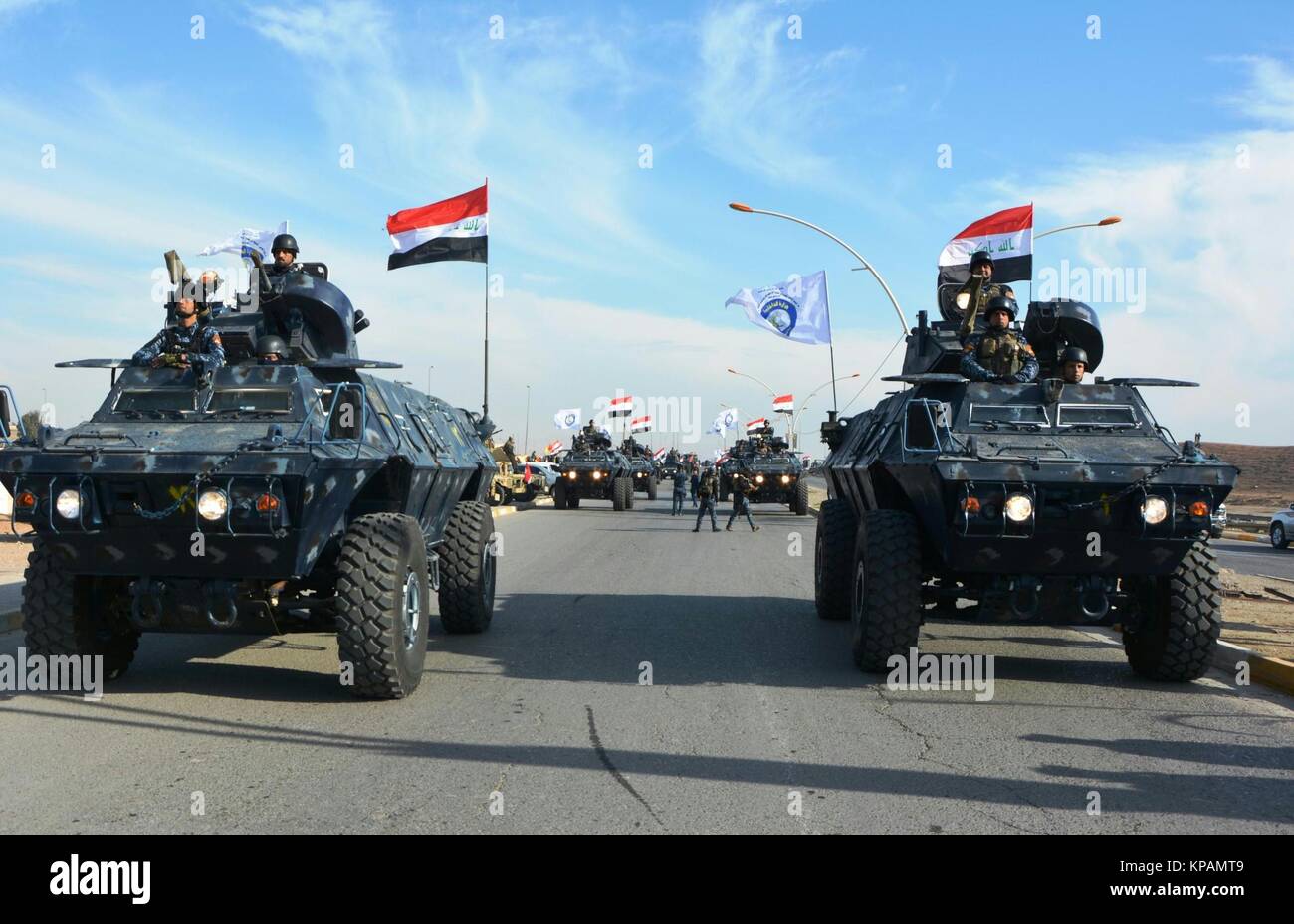 Mosul. 14th Dec, 2017. Iraqi armored vehicles take part in a parade in Mosul, Iraq on Dec. 14, 2017. Ninevah Operation Command of the Iraqi military on Thursday paraded in Mosul to celebrate the full liberation of Iraqi lands of the Islamic State (IS) group. Credit: Khalil Dawood/Xinhua/Alamy Live News Stock Photo
