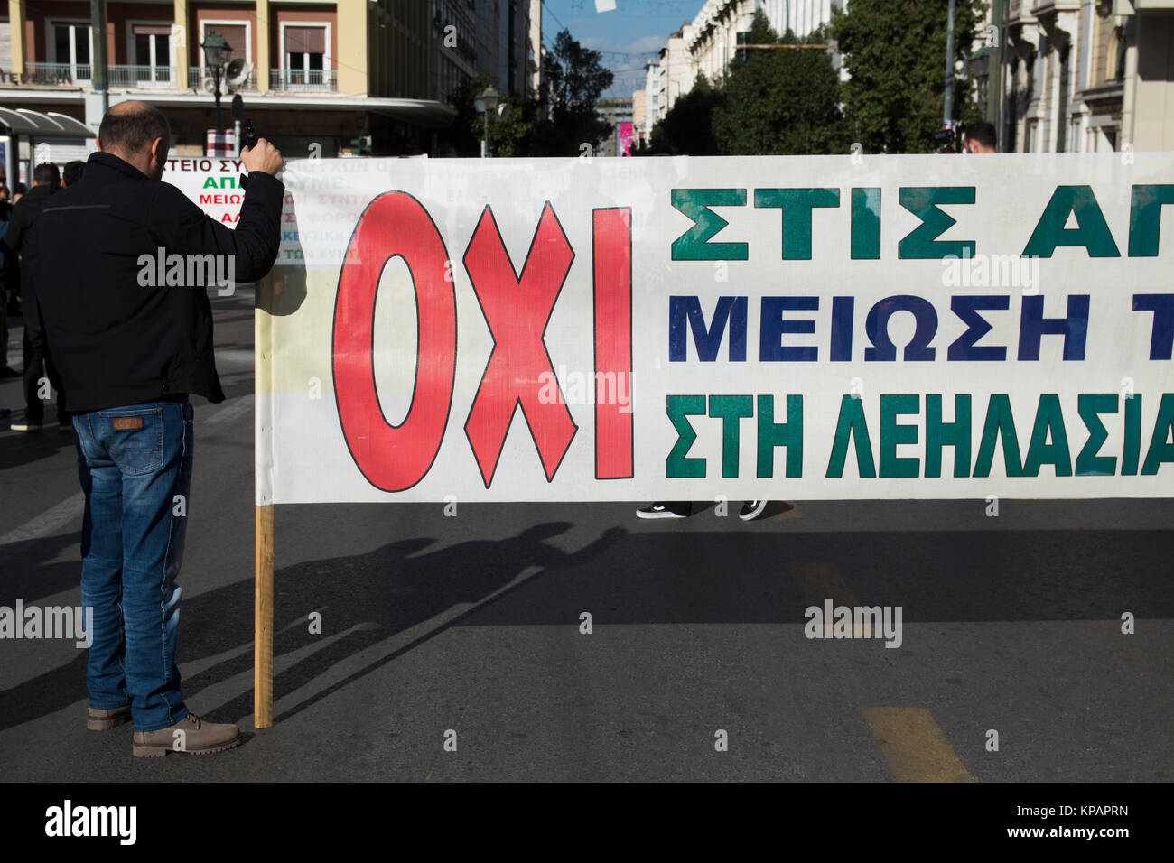 A banner reads 'OXI', meaning 'No', as thousands took to the streets participating in a 24 hour general strike organized by private and public sector unions, protesting against the government's recent attempt to amend labor laws, making it more difficult for unions to go on strike. © Nikolas Georgiou / Alamy Live News Stock Photo