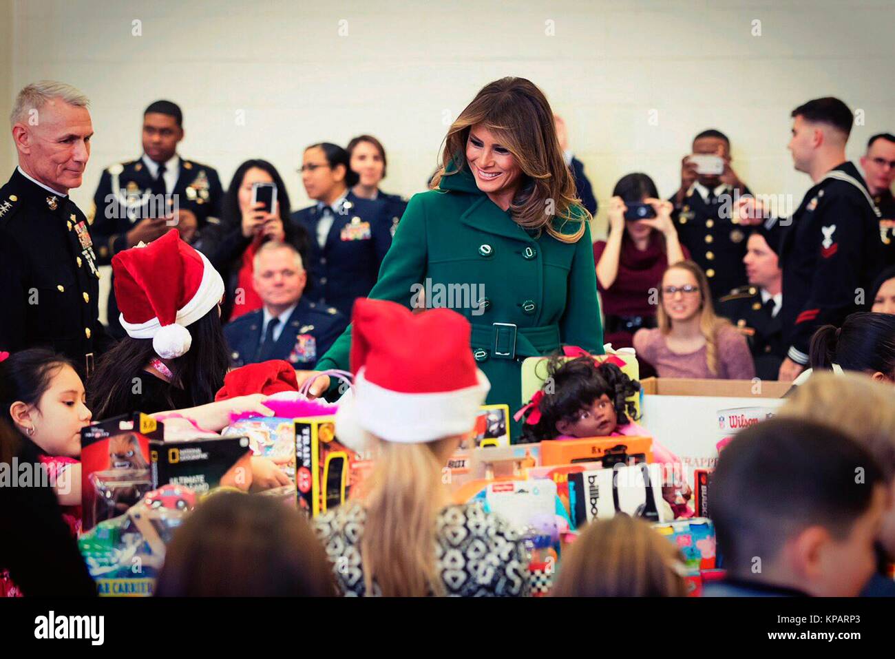 Washington, United States Of America. 14th Dec, 2017. U.S. First Lady Melania Trump helps pack toys during the annual Marine Corps Foundation Toys for Tots event at Joint Base Anacostia-Bolling December 13, 2017 in Washington, DC. The First Lady followed the longstanding tradition of other Firs Ladies in helping children make cards, sorted toys and honor the charity event.  Credit: Planetpix/Alamy Live News Stock Photo