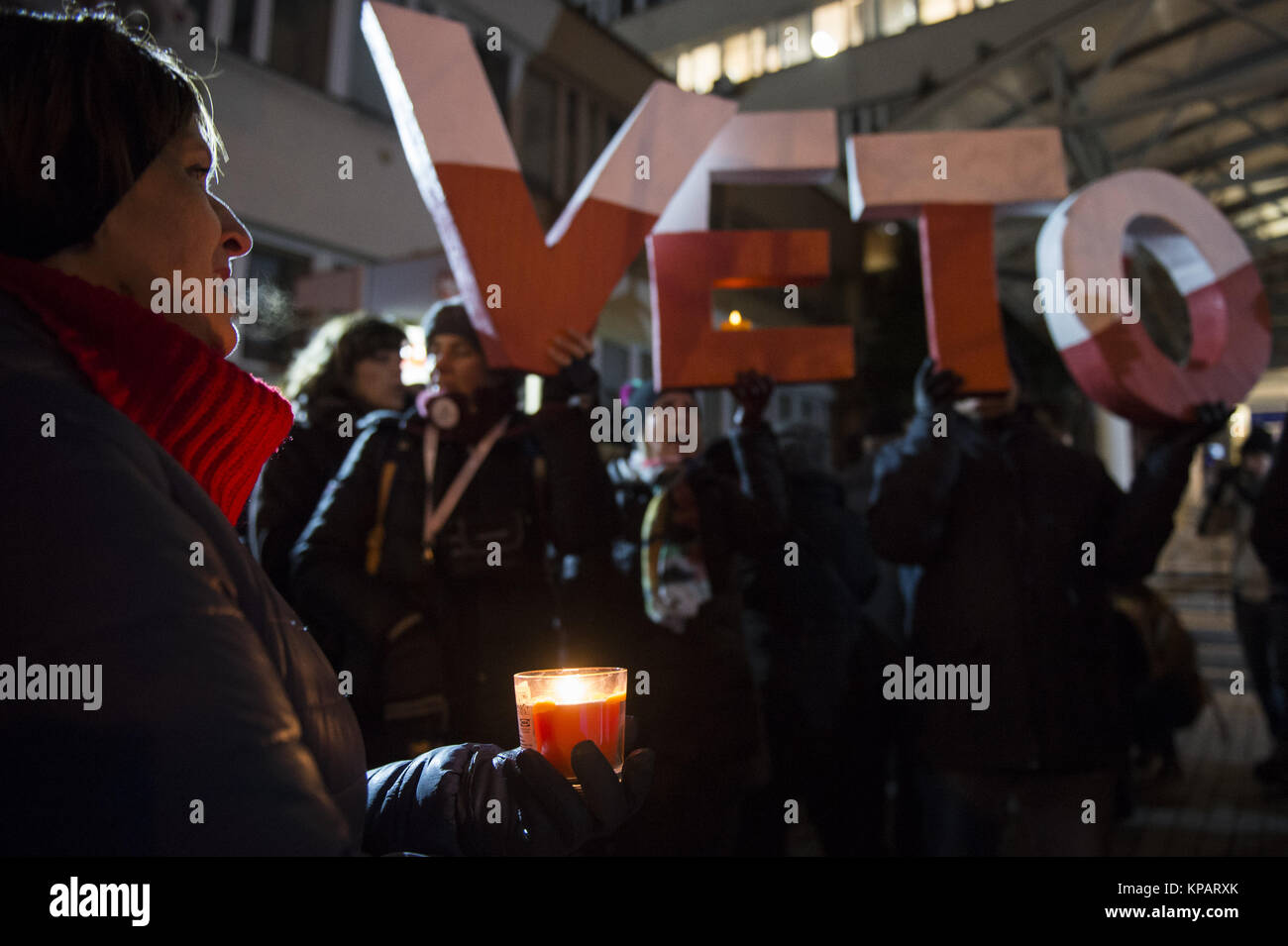 Krakow, Poland. 14th Dec, 2017. Protesters hold the word VETO during a protest called ''chain of light'' against the reform of acts on the Supreme Courts in Krakow.The Supreme Court law is being debated in the Senate today. The Protest ''Chain of Light is taking place in 37 cities in Poland. Credit: Omar Marques/SOPA/ZUMA Wire/Alamy Live News Stock Photo