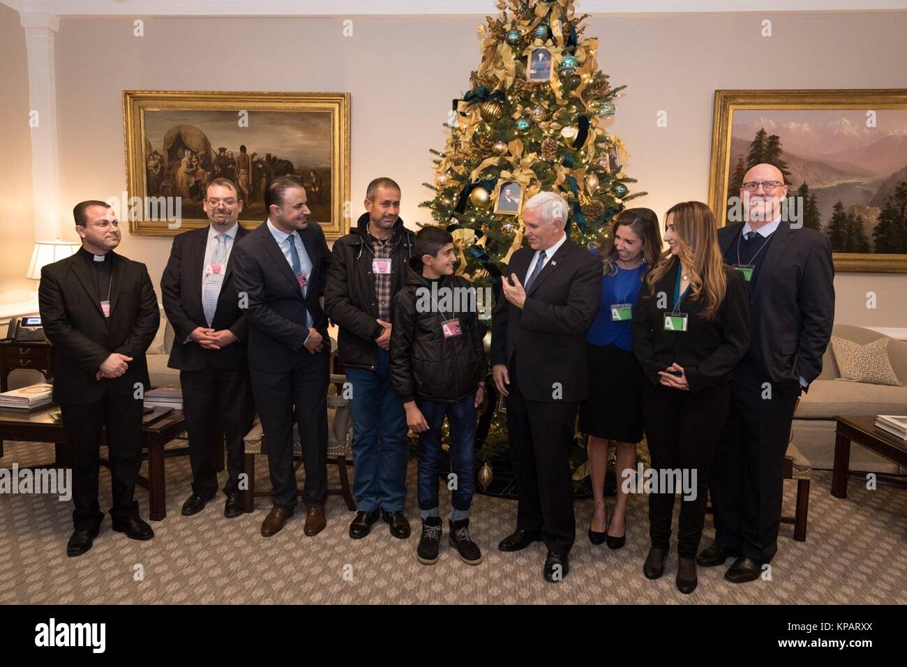 U.S. Vice President Mike Pence, center, meets with 12-year-old Noeh, at the White House December 14, 2017 in Washington, DC.  Noeh is an Iraqi Christian boy whose home was destroyed by the Islamic State in the Nineveh Plains of Iraq. Stock Photo