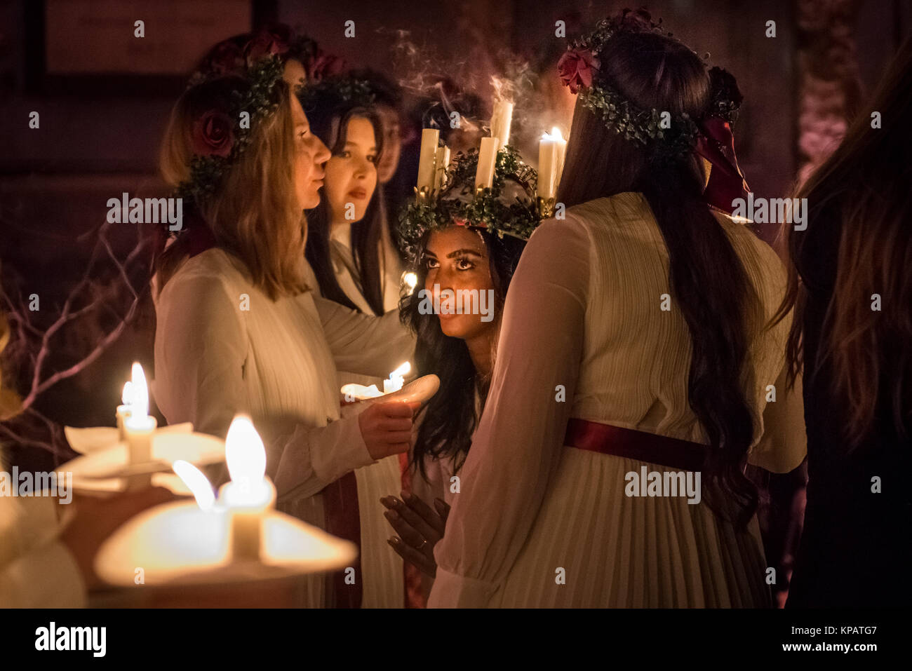 London, UK. 14th December, 2017. Swedish choir with candles and head
