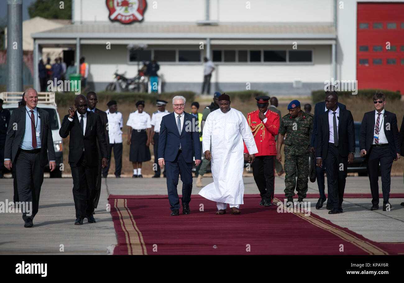 German President Frank-Walter Steinmeier (L) is bidden farewell with military honours by the president of the Republic of The Gambia, Adama Barrow, at the airport in Banjul, The Gambia, 14 December 2017. Steinmeier is returning to Berlin after a 4-day visit to Ghana and The Gambia. Photo: Bernd von Jutrczenka/dpa Stock Photo