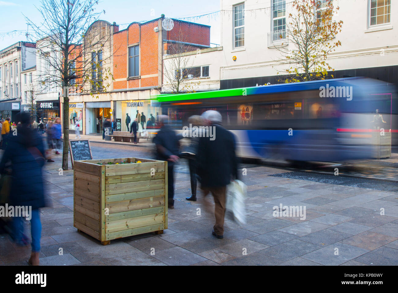 Preston, Lancashire, UK. 15th Dec, 2017. Security Alert. Anti-Terrorist devices, or vehicle buffers have been installed overnight in the cities High Street. Shoppers in Fishergate have now to negotiate around large wooden planters filled with concrete & topped off with winter pansies. The devices designed to thwart a vehicle led attack targeting Christmas shoppers & pedestrians have been greeted with some amusement by residents, variously described as the largest litter bins on the street, an eyesore and a huge obstruction for the visually impaired. Credit: MediaWorldImages/Alamy Live News Stock Photo