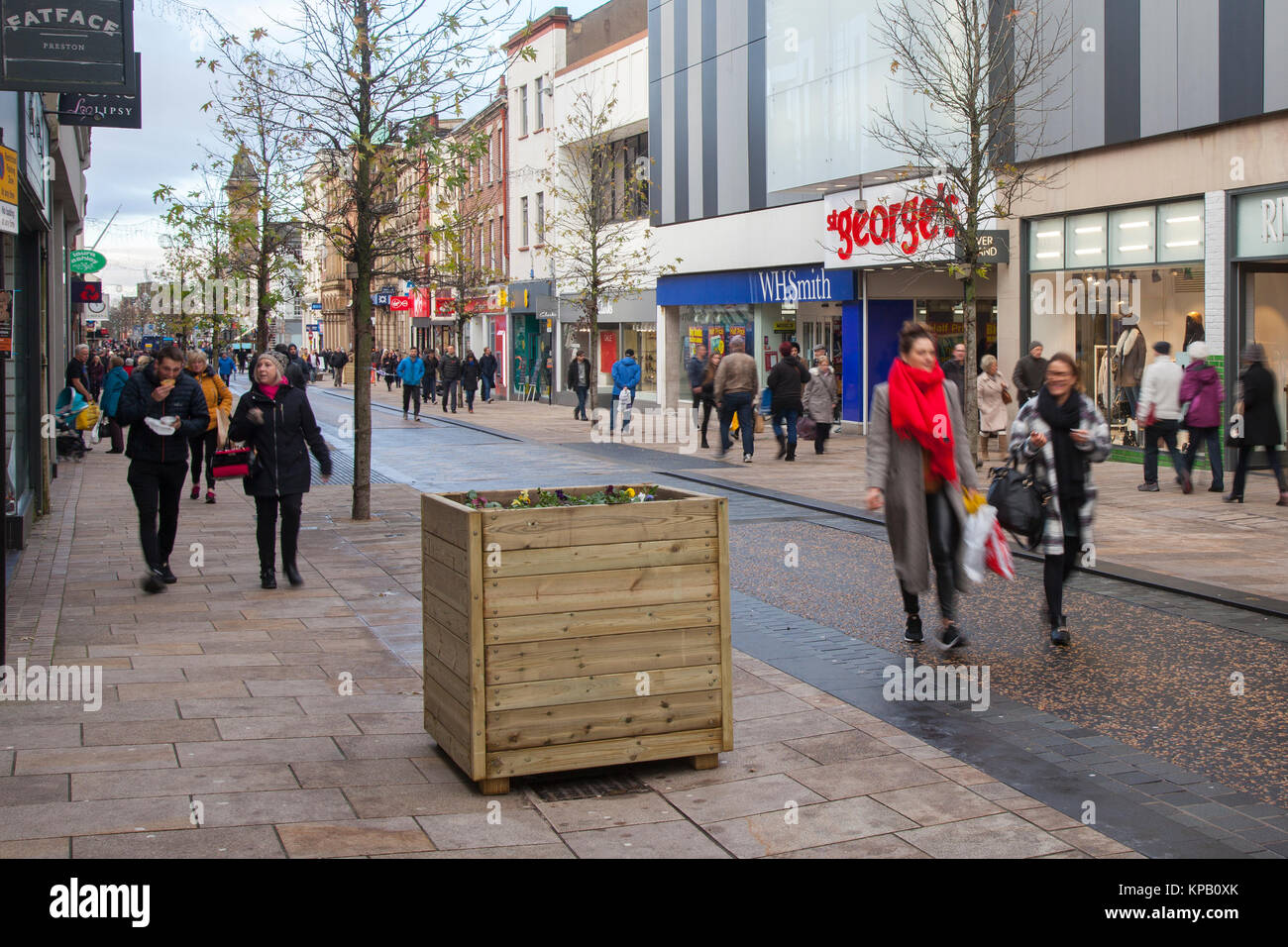 Preston, Lancashire, UK. 15th Dec, 2017. Security Alert. Anti-Terrorist devices, or vehicle buffers have been installed overnight in the cities High Street. Shoppers in Fishergate have now to negotiate around large wooden planters filled with concrete & topped off with winter pansies. The devices designed to thwart a vehicle led attack targeting Christmas shoppers & pedestrians have been greeted with some amusement by residents, variously described as the largest litter bins on the street, an eyesore and a huge obstruction for the visually impaired. Credit: MediaWorldImages/Alamy Live News Stock Photo