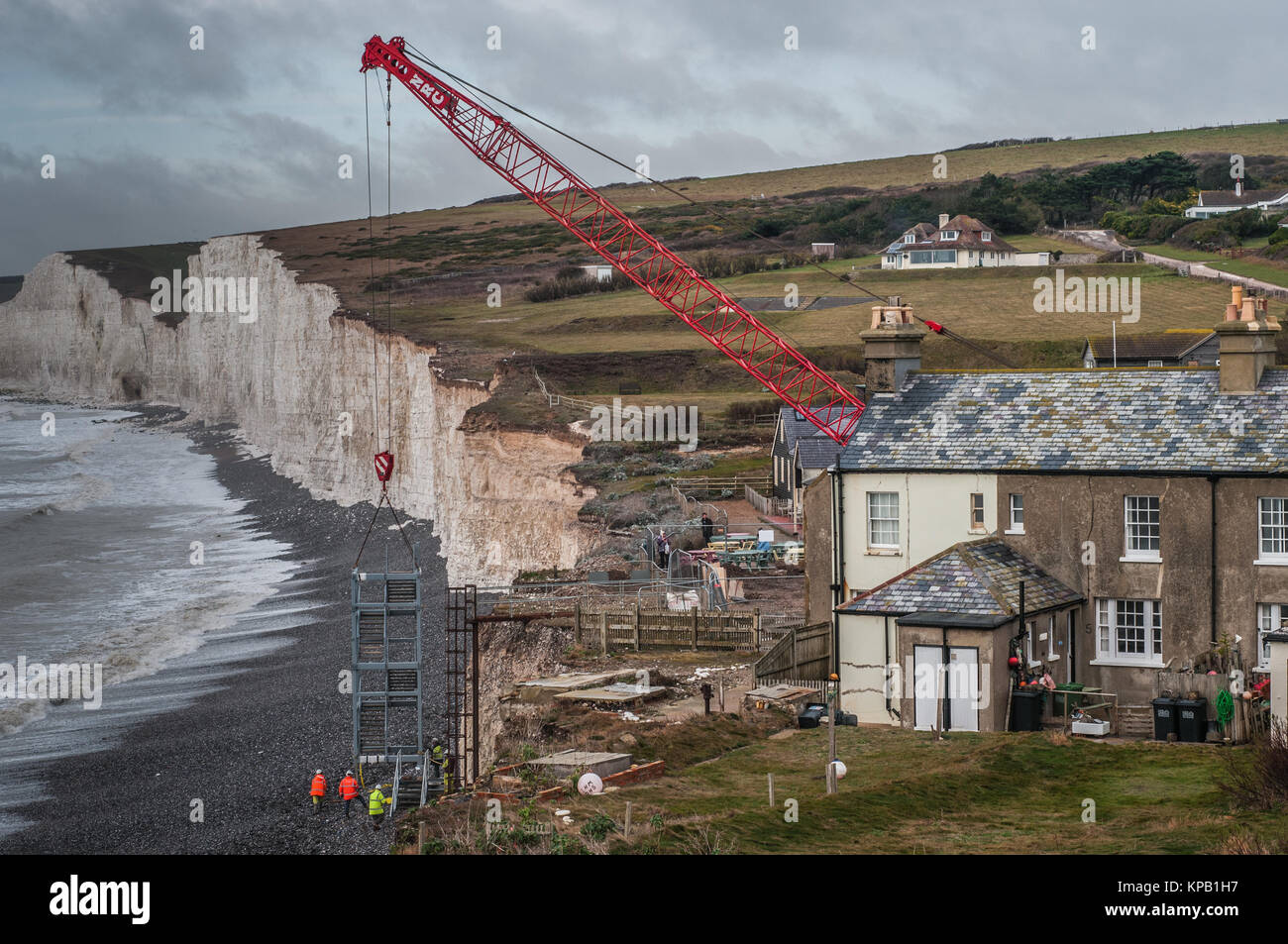 Birling Gap. East Sussex, UK..15 December 2017..New replacement beach access steps at the National Trust site on the South Coast are lifted into position. Accelerated erosion of the Chalk cliffs has necessited work to be carried out some years earlier than planned. Weather permitting the work should be completed before Christmas allowing public access to the beach once again. . Stock Photo