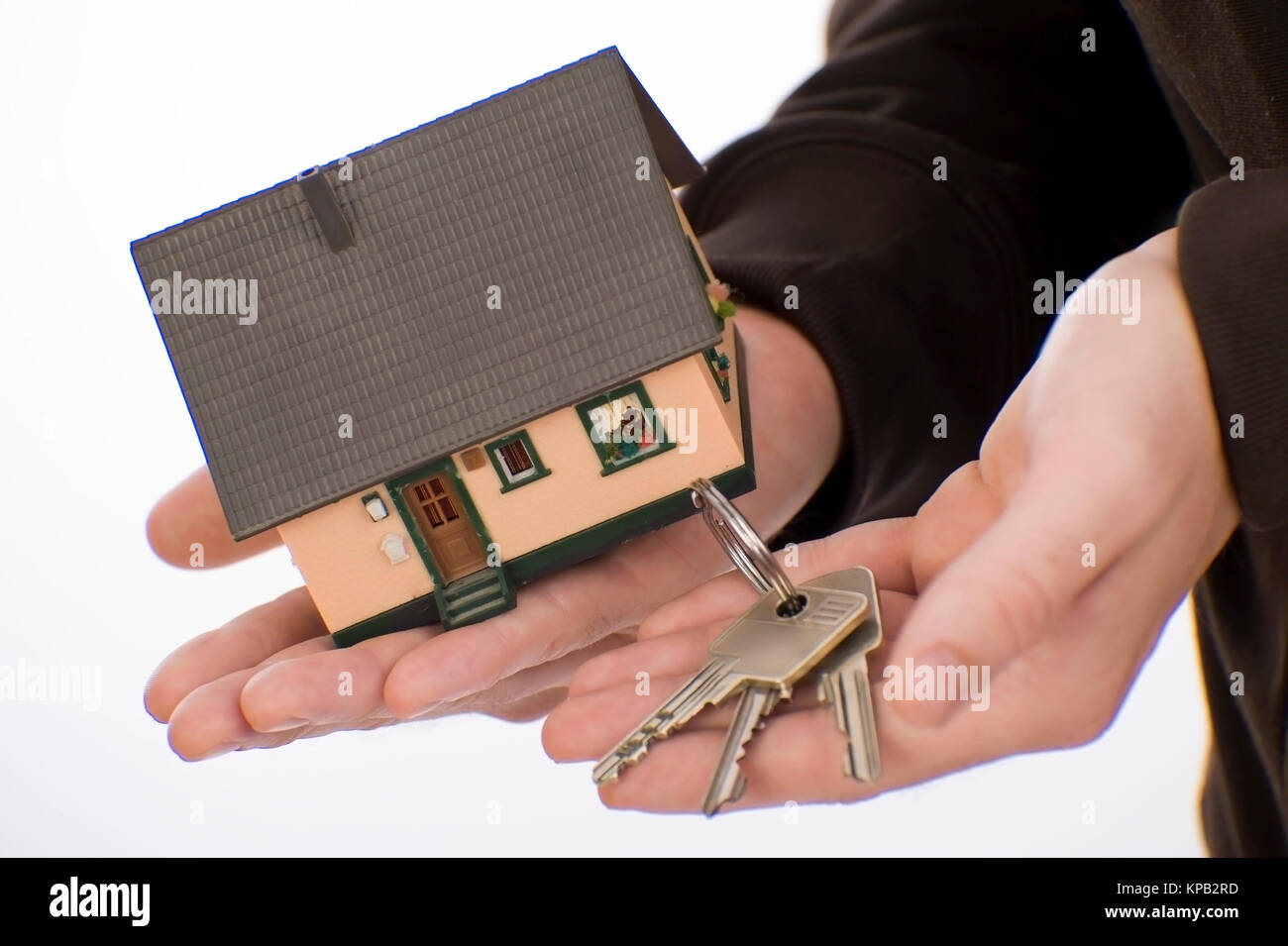 Model release, Haus und Schluessel in der Hand, Symbolbild Hauskauf - house and key in hand Stock Photo