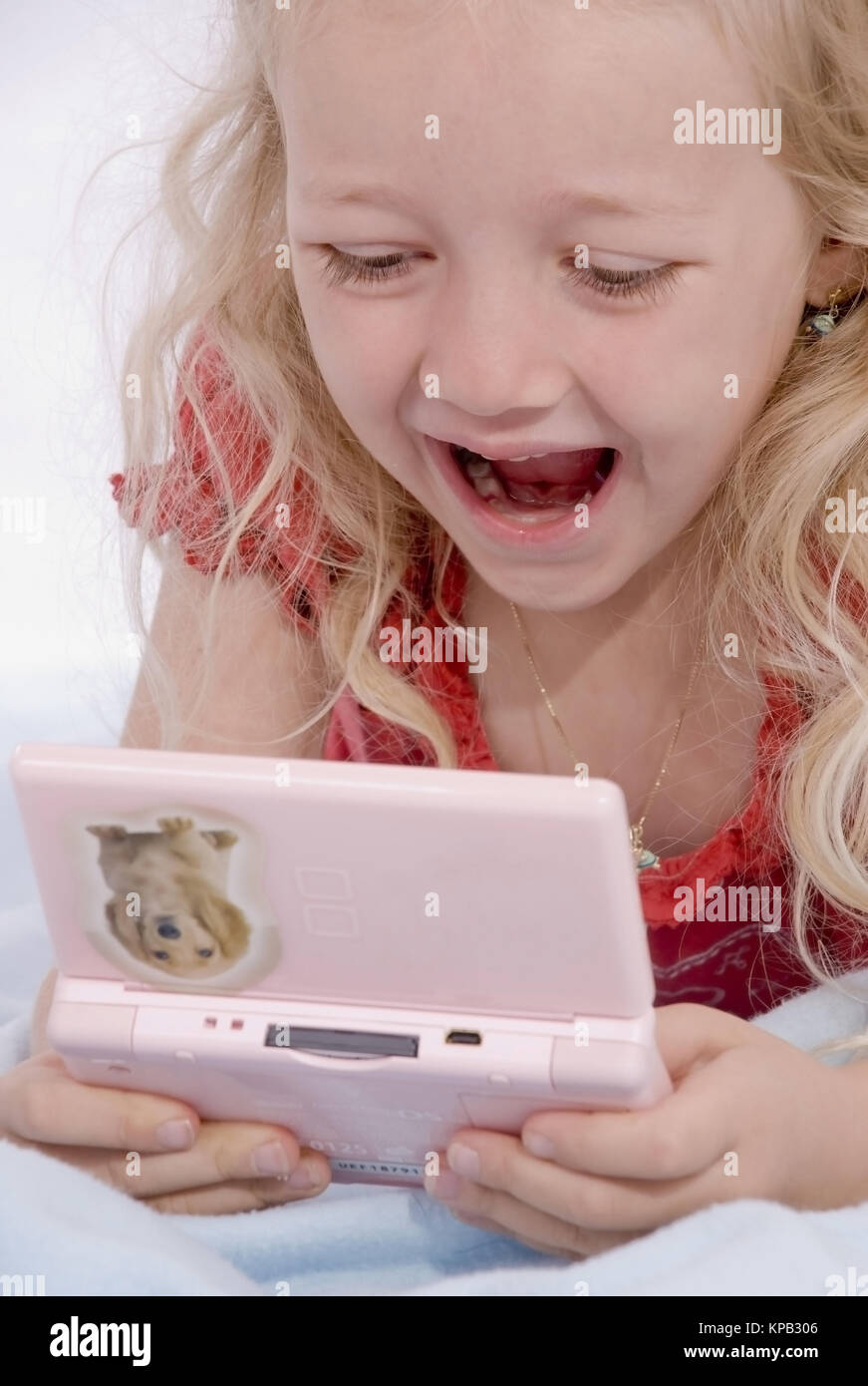 Model release, Maedchen mit Computerspiel - girl with computer game Stock Photo