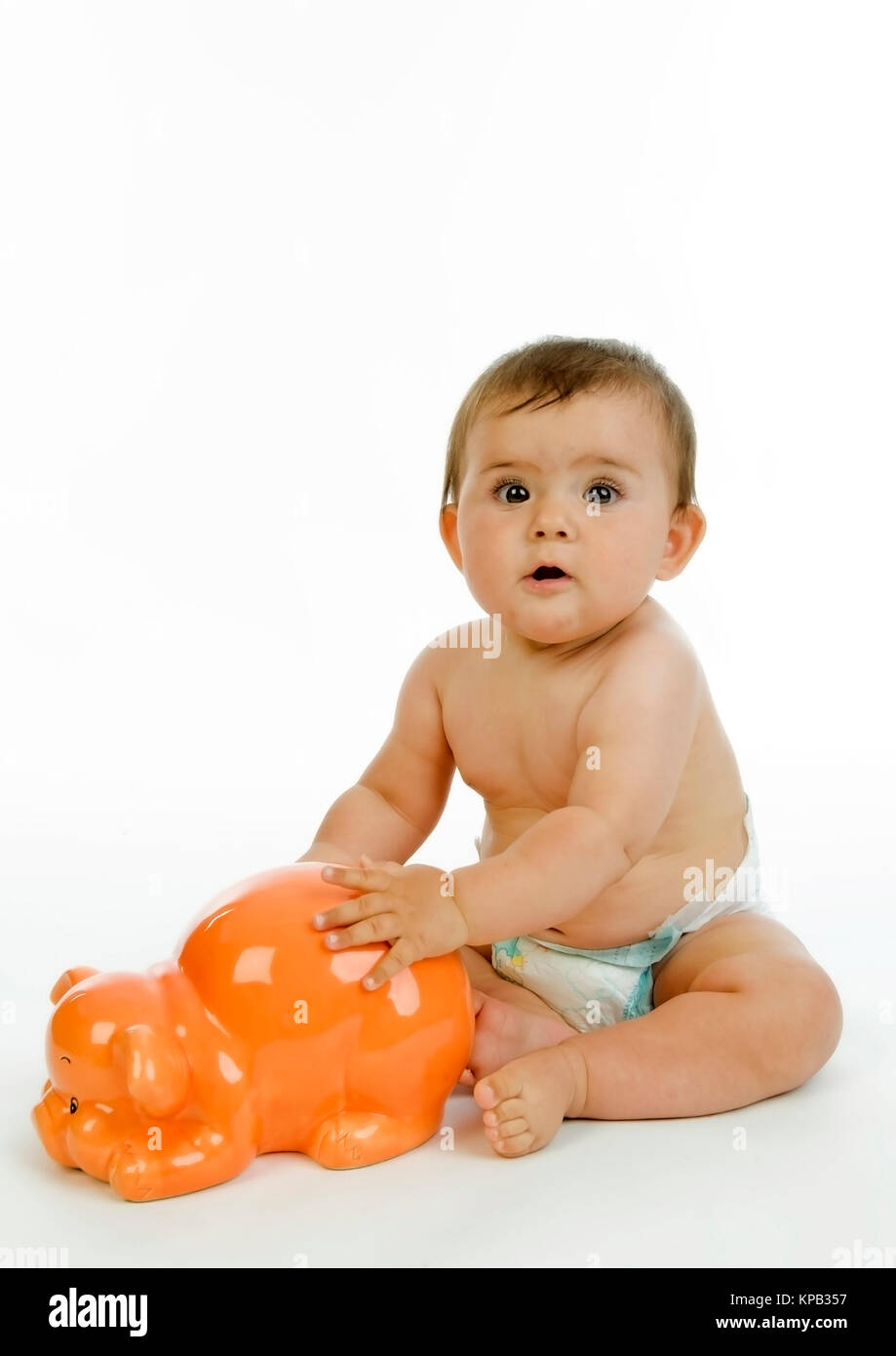Model release, Kleinkind mit Sparschwein, Symbolbild Altersvorsorge - little child with piggy bank Stock Photo