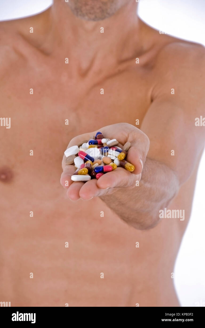 Model release, Mann haelt Tabletten in der Hand - man with tablets in hand Stock Photo