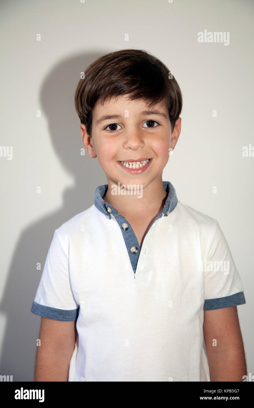 Young Boy Portrait Against Wall Stock Photo - Alamy