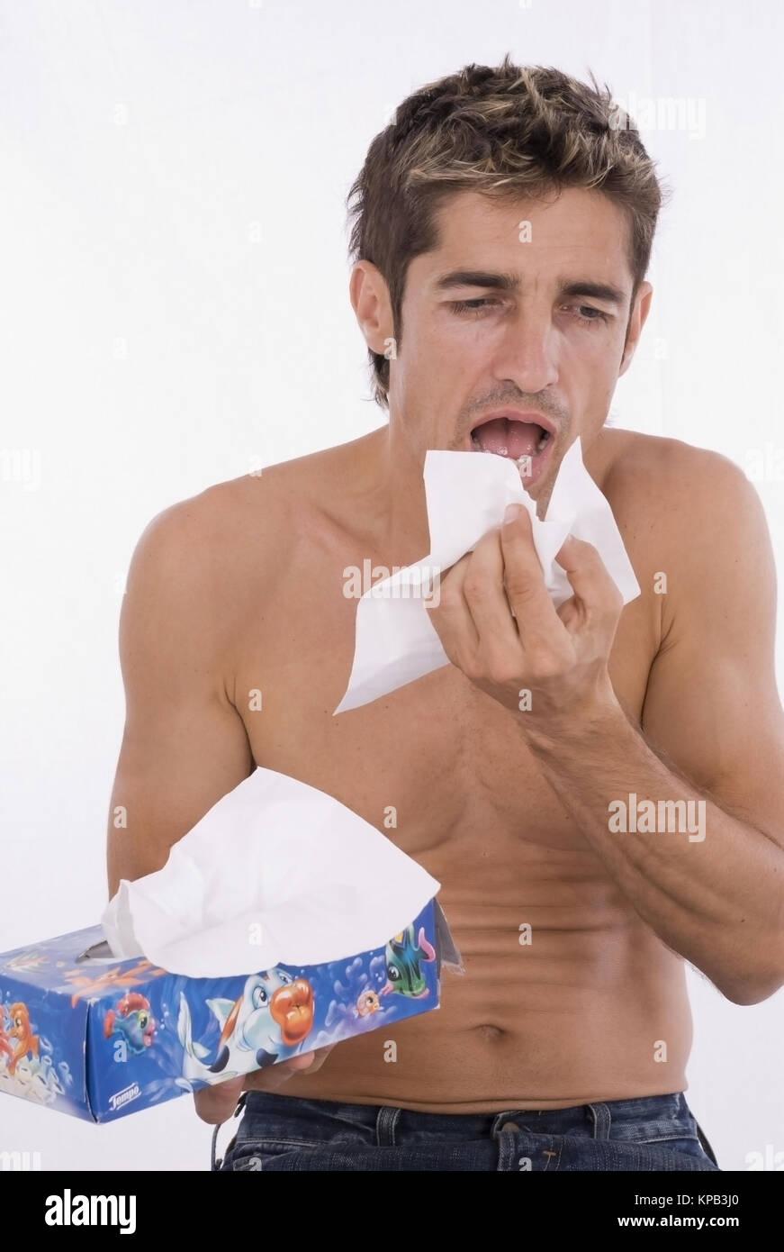 Model release, Mann schneuzt sich - man is blowing his nose Stock Photo