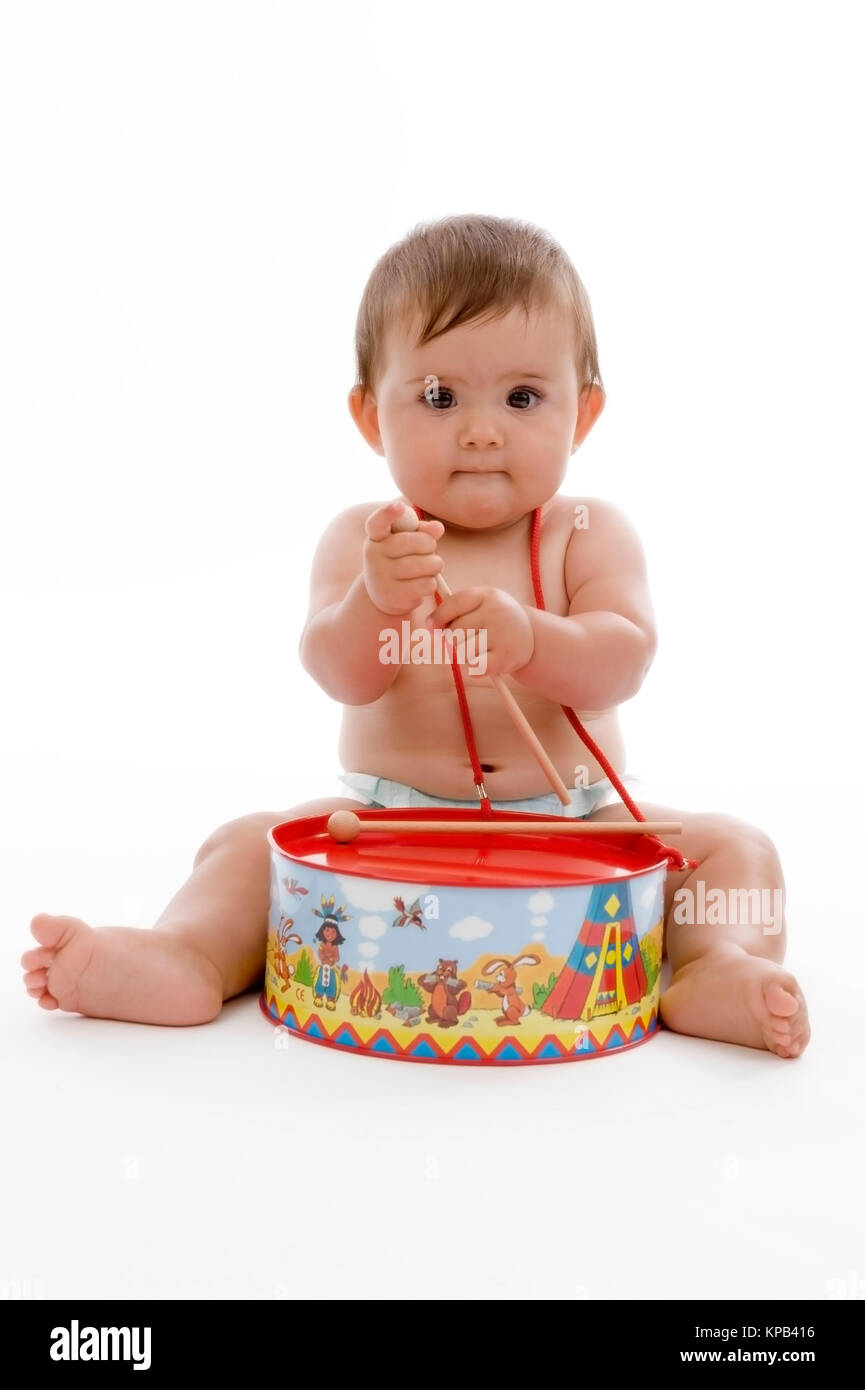 Model release, Kleinkind, 8 Monate, mit Kindertrommel - little child with toy drums Stock Photo