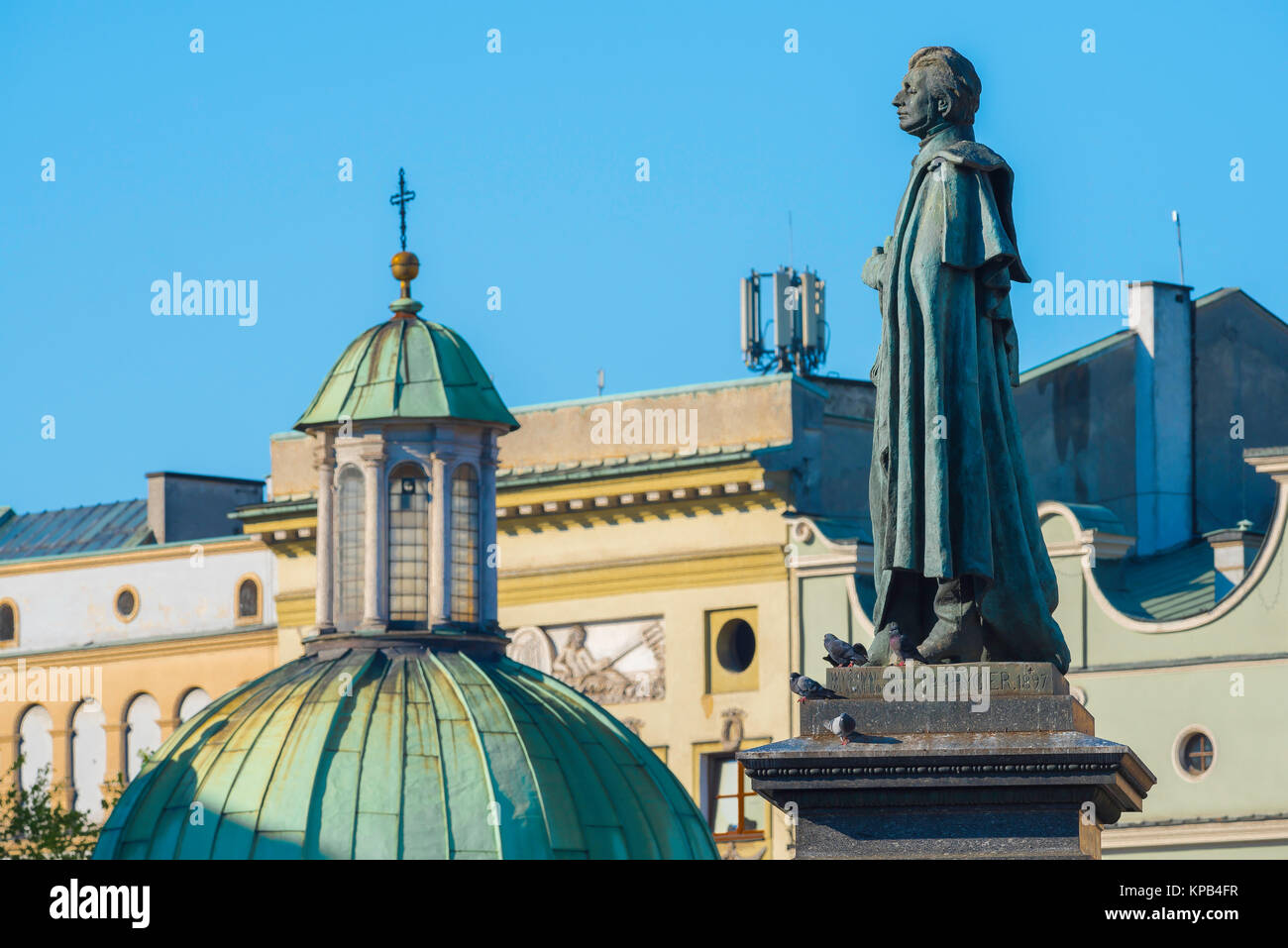 Krakow Market Square, statue of Adam Mickiewicz alongside the lantern