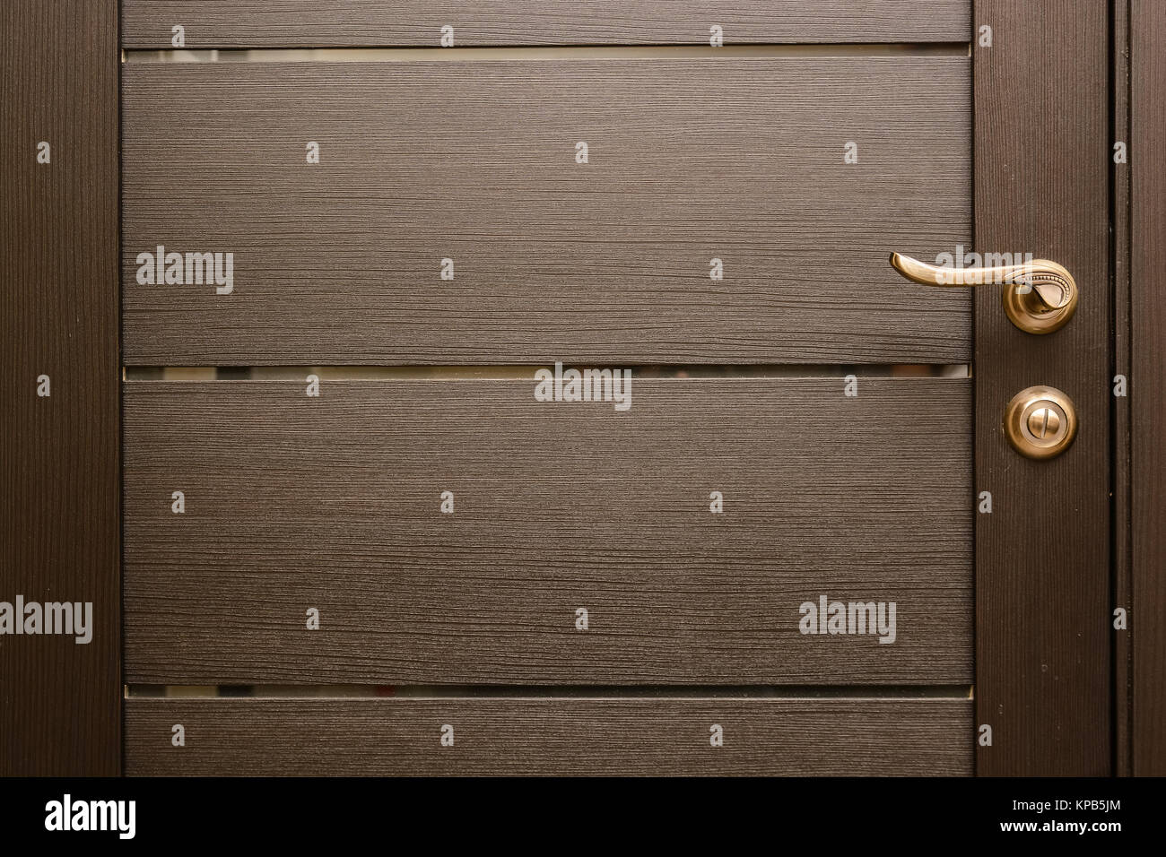 Closeup of metal bronze door handle on wooden door Stock Photo Alamy