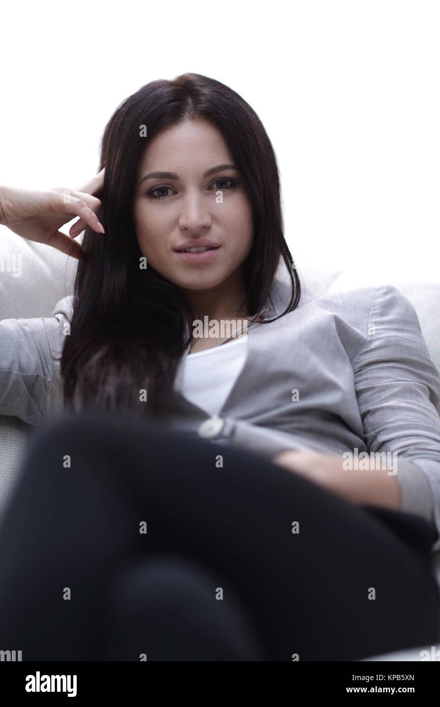 Close-up portrait of a beautiful young woman sitting in a chair Stock ...