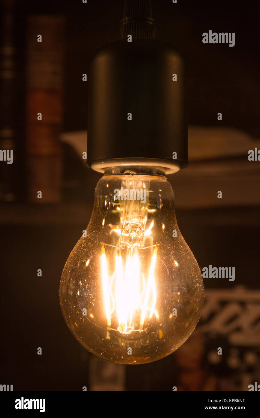 Light bulb on black background Stock Photo - Alamy