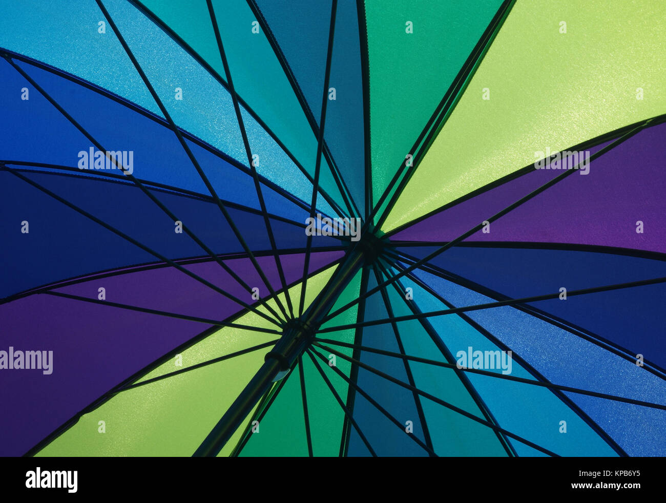 Detail of a colorful open umbrella watched from underneath while sunshine Stock Photo Alamy