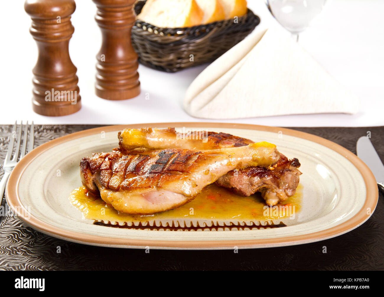 Grilled and baked duck legs Stock Photo - Alamy