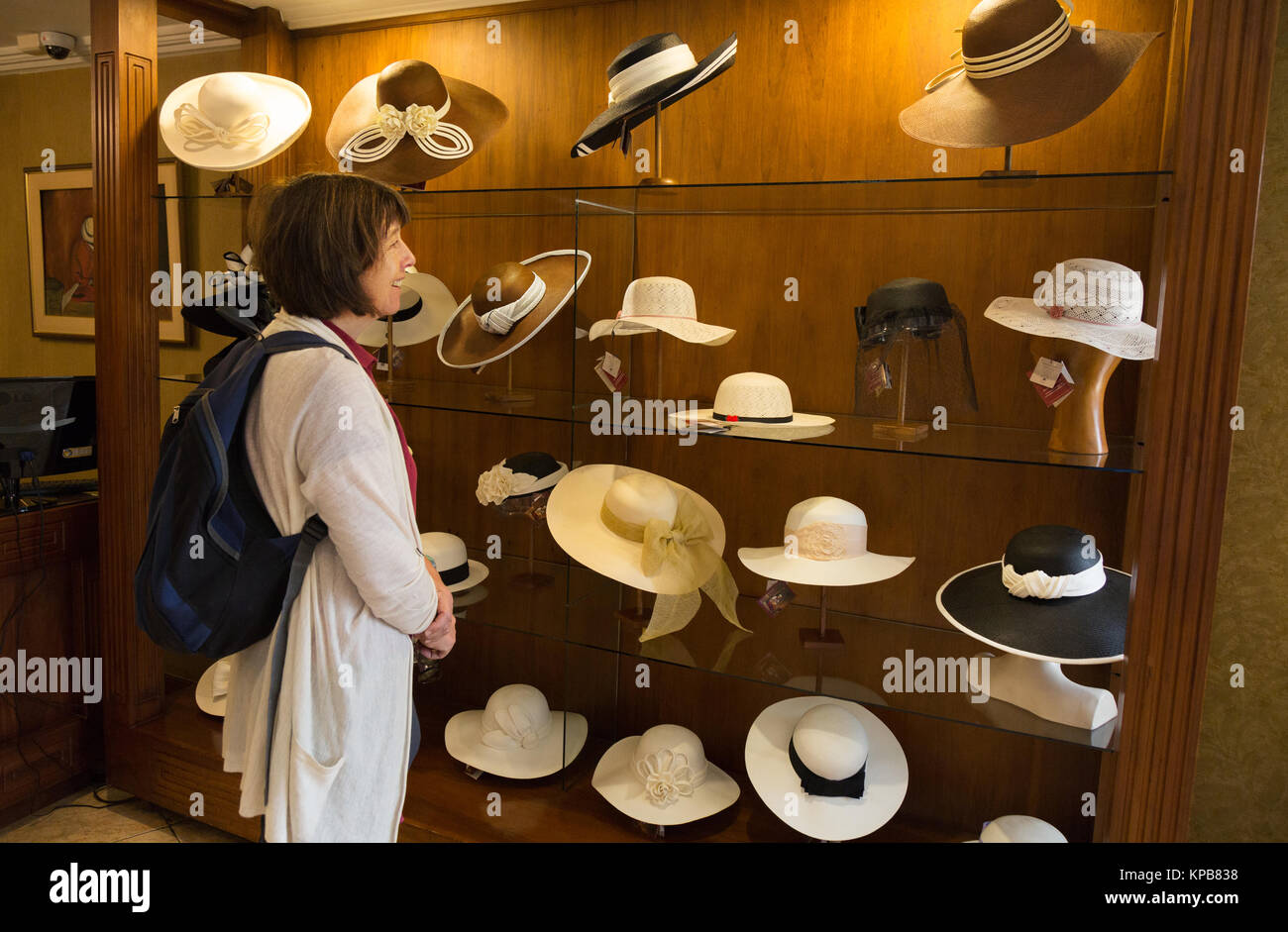 Ecuador panama hats - woman shopping for a panama hat, Homero Ortega factory and Museum, Cuenca, Ecuador South America Stock Photo