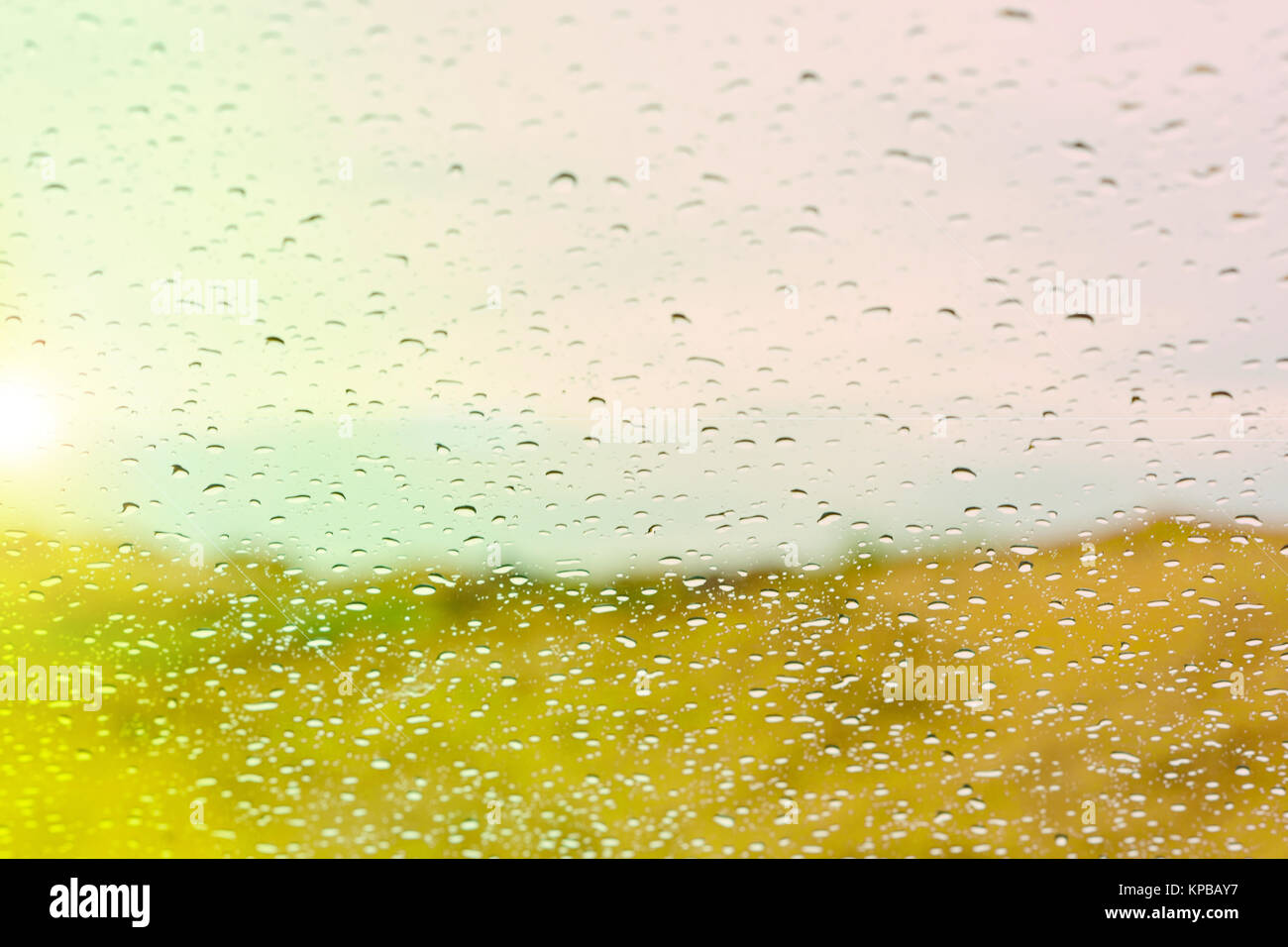 Water drops on glass against the sunset background Stock Photo - Alamy
