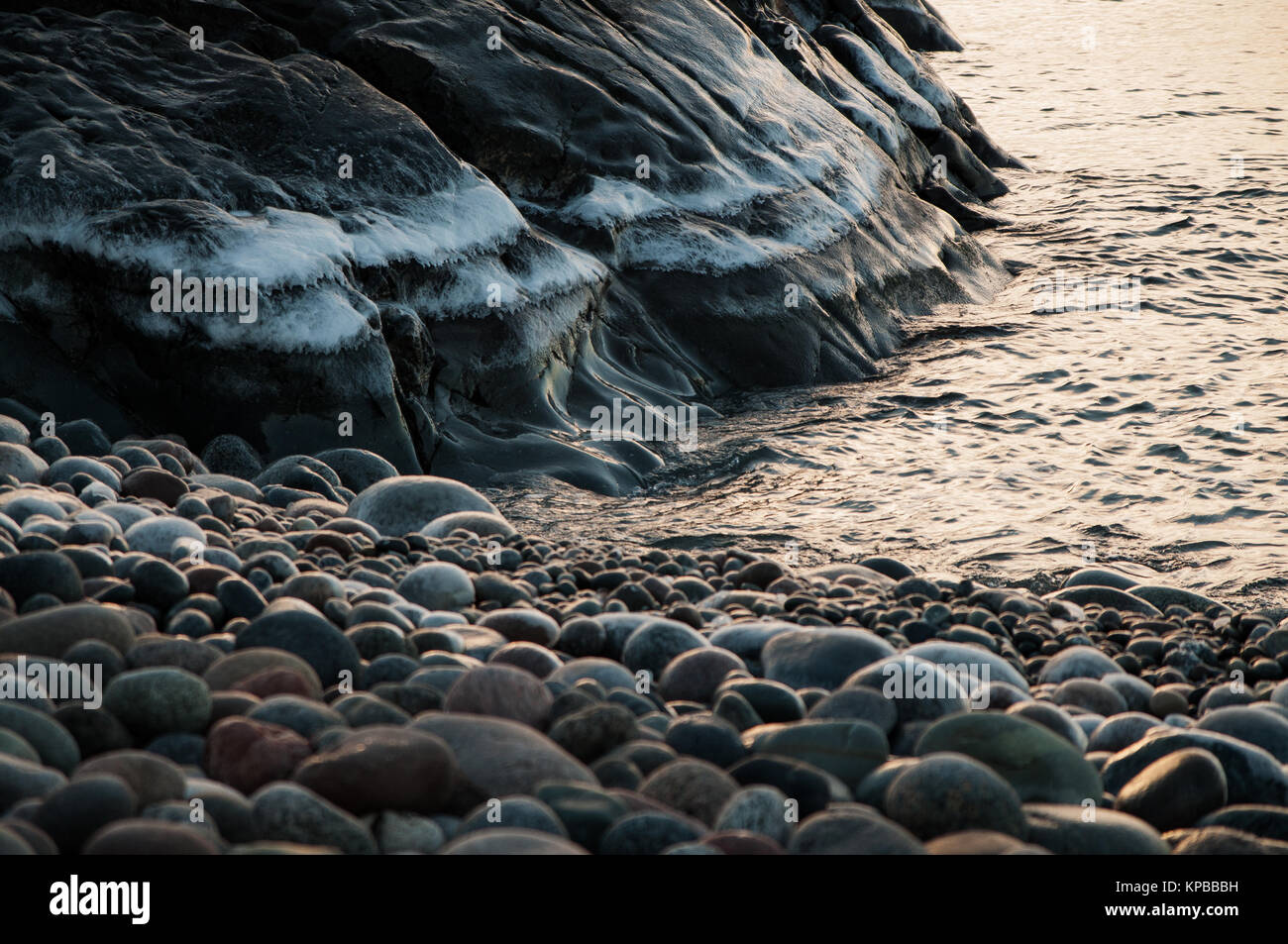 Rosted Rocks Frosted mountain and many different rocks by the water at sunrise ...